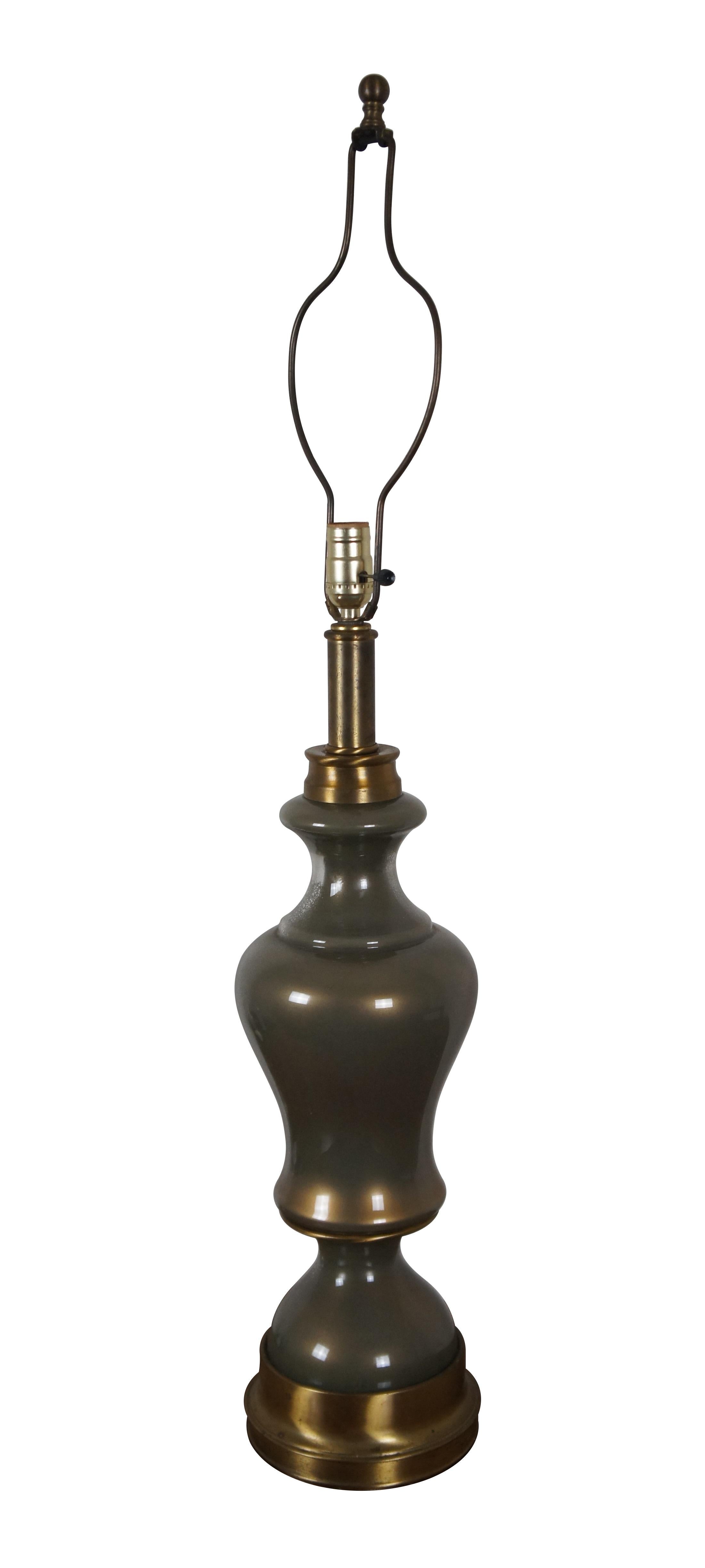 Vintage Hollywood Regency style glass and brass table lamp featuring round serpentine form.

Dimensions:
7.25