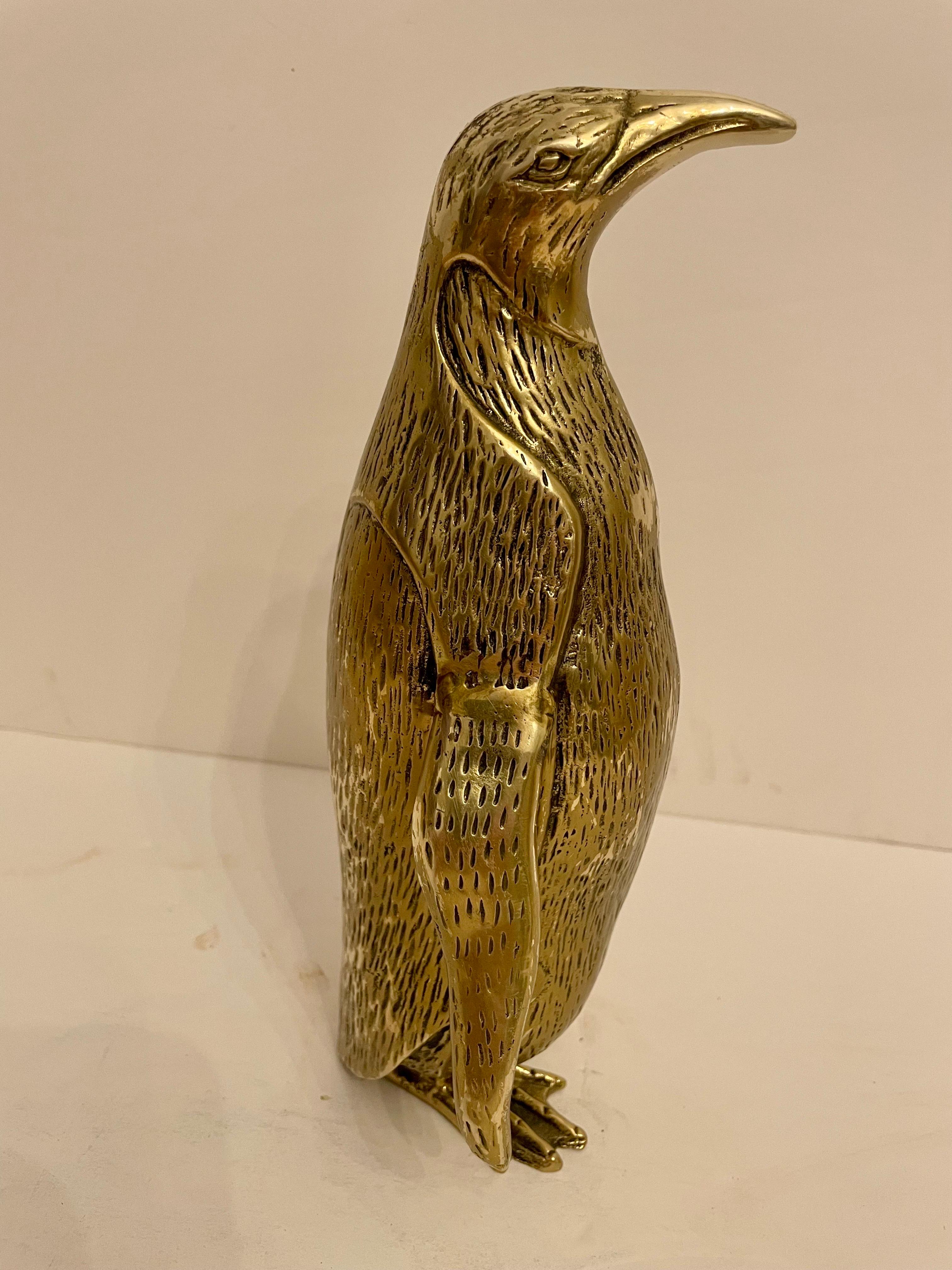 Vintage Hollywood Regency brass Penguin sculpture. Nicely detailed. Original patina intact. Good overall condition. Made in Korea Measures 9.75” tall x 6”wide x 3.5” deep.