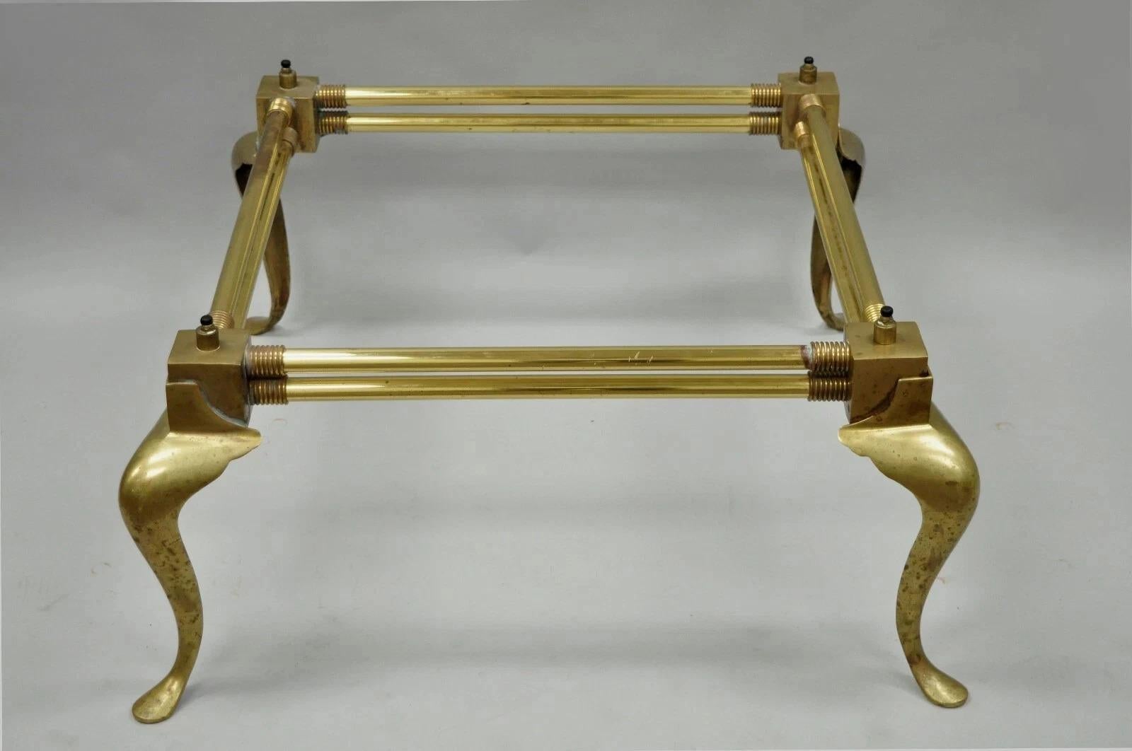 Vintage Hollywood Regency Brass Queen Anne Legs Square Coffee Table Base attributed to Mastercraft (Glass not included). Item features a brass frame, Queen Anne style legs, unique ring design at top of legs, rubber stoppers which allows for a raised
