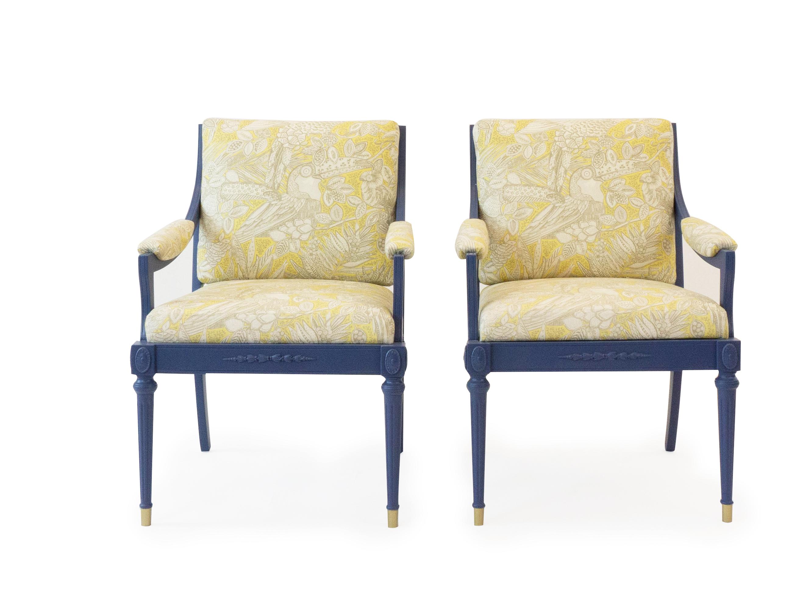 This pair of vintage Hollywood Regency chairs have been newly lacquered in farrow and ball pitch blue and upholstered in Jim Thompson's Amazonia / Lemon Verbena fabric. The upholstered fabric is a yellow and white print featuring tropical florals