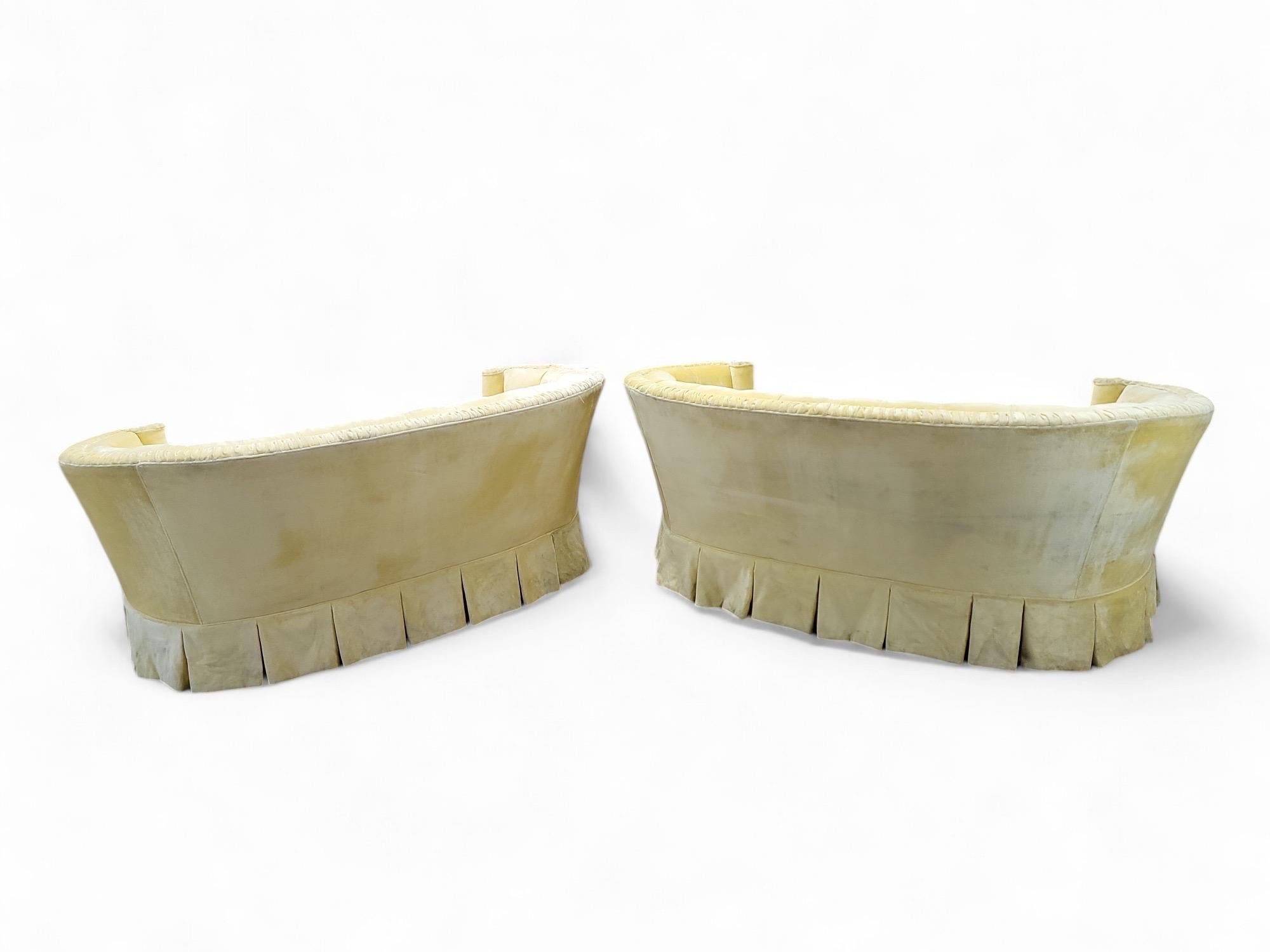 Vintage Hollywood Regency Curved Chesterfield Love-Seats Sofas For Upholstery - Pair

This pair of Vintage Hollywood Regency Curved Chesterfield Love-Seats offers a timeless elegance, perfect for enhancing any interior space. These sofas feature the