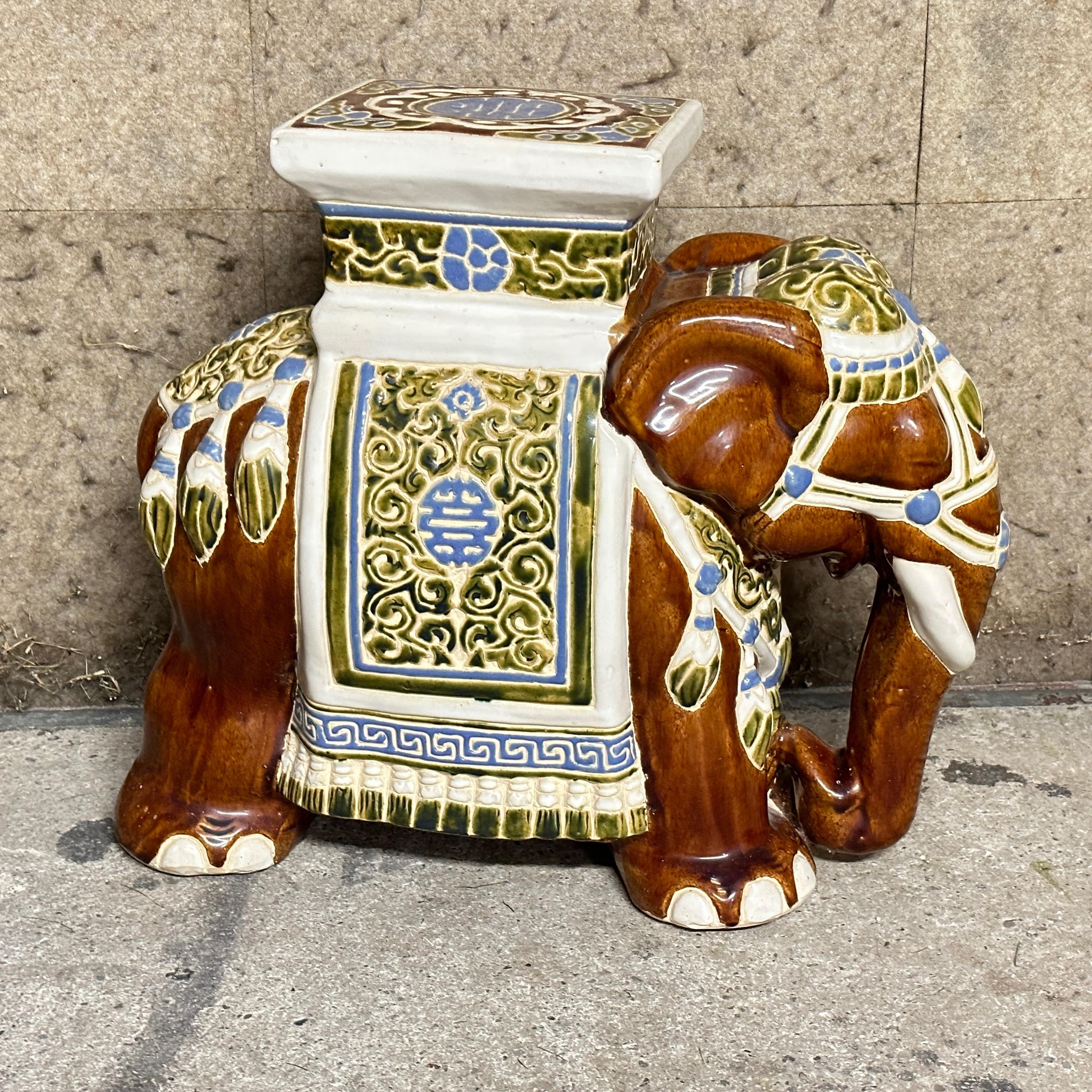 Mid-20th century glazed ceramic elephant garden stool, flower pot seat or side table. Handmade of ceramic. Nice addition to your home, patio or garden. Also nice in your pool area to hold your personal belongings. Found at an estate sale in Vienna,