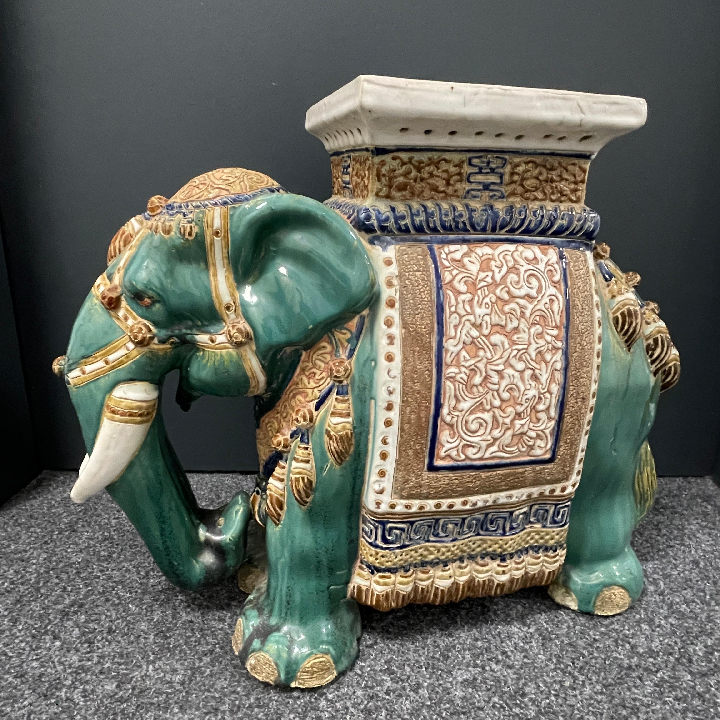 Mid-20th century glazed ceramic elephant garden stool, flower pot seat or side table. Handmade of ceramic. Nice addition to your home, patio or garden. Also nice in your pool area to hold your personal belongings.
 