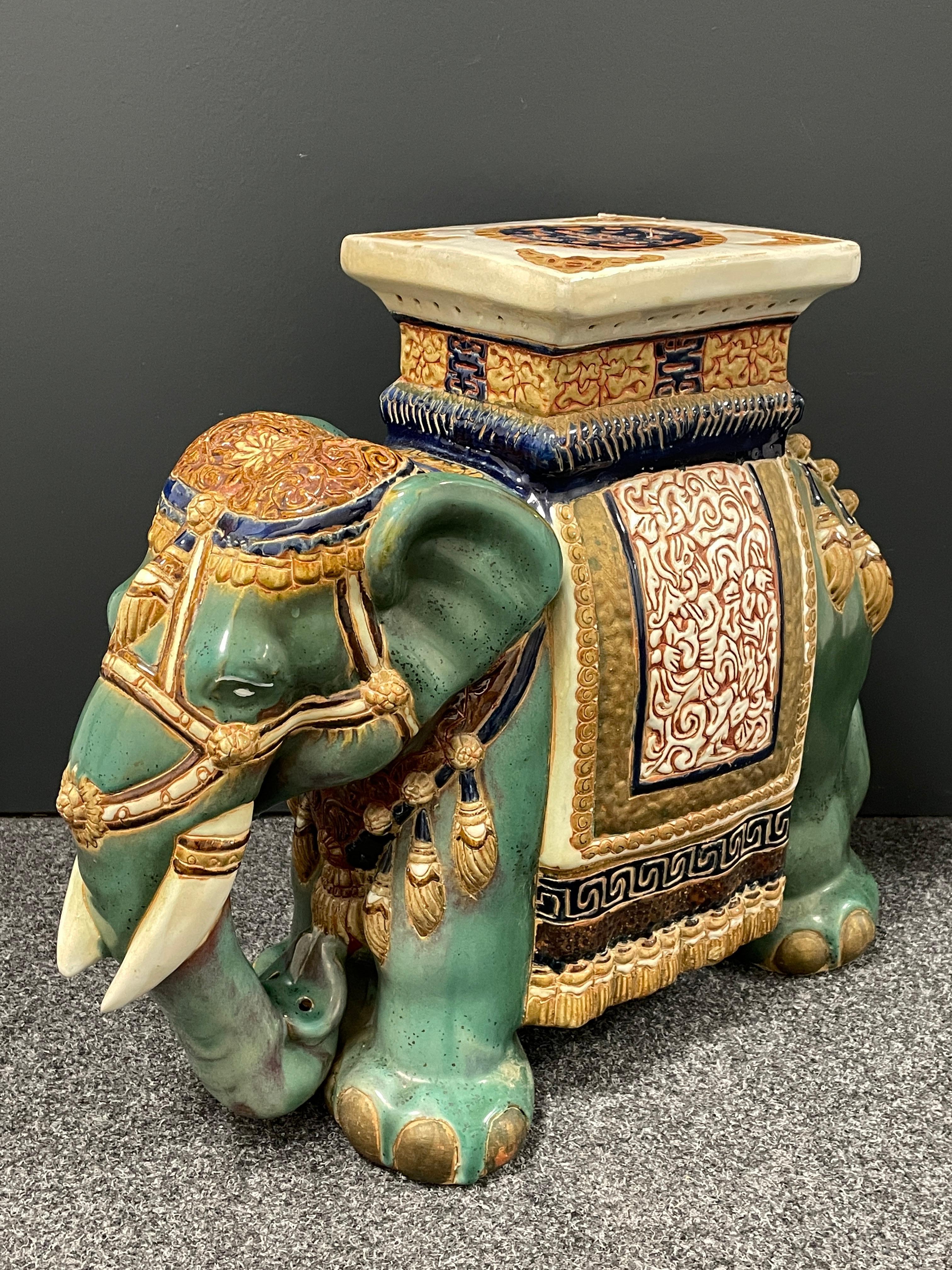 Mid-20th century glazed ceramic elephant garden stool, flower pot seat or side table. Handmade of ceramic. Nice addition to your home, patio or garden. Also nice in your pool area to hold your personal belongings.
 