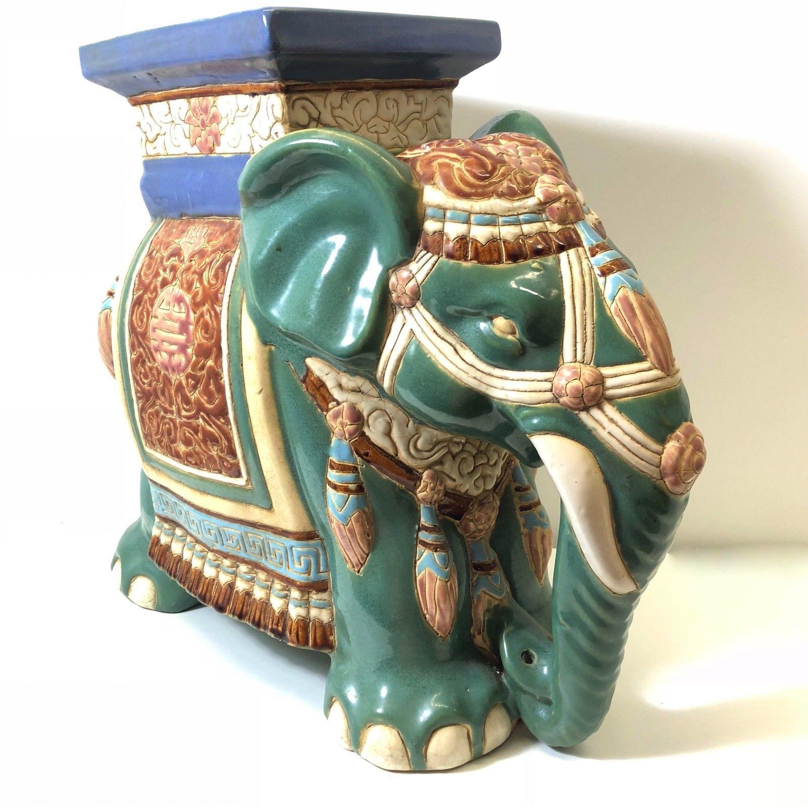 green ceramic elephant plant stand