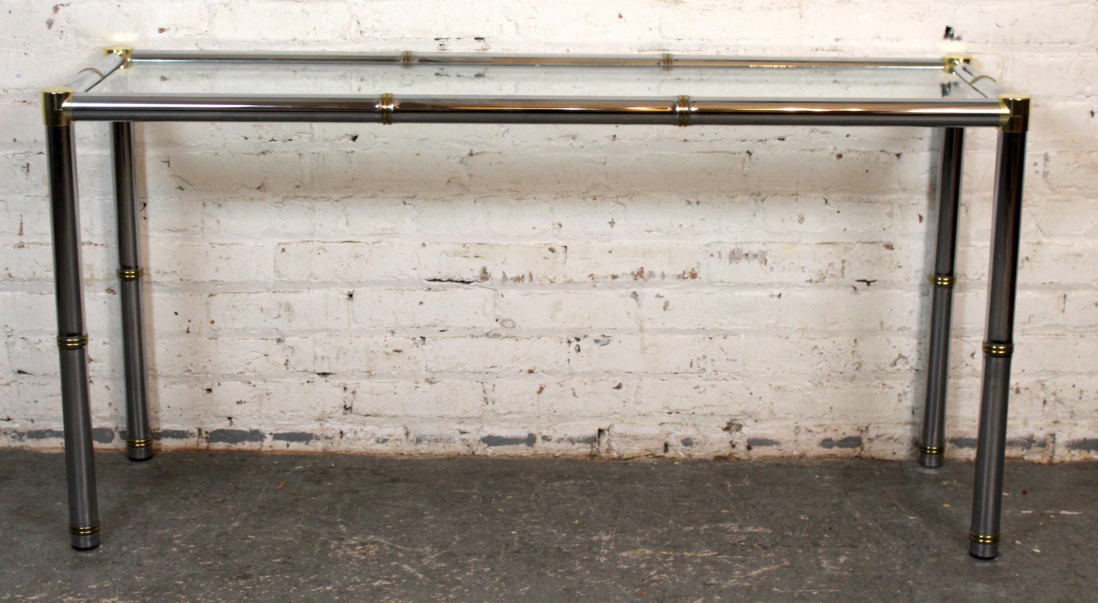 Sleek and modern, this table features a polished chrome base paired with a clear glass top, creating a refined balance of industrial and minimalist design. The transparent surface highlights the sculptural base, making it an ideal centerpiece for