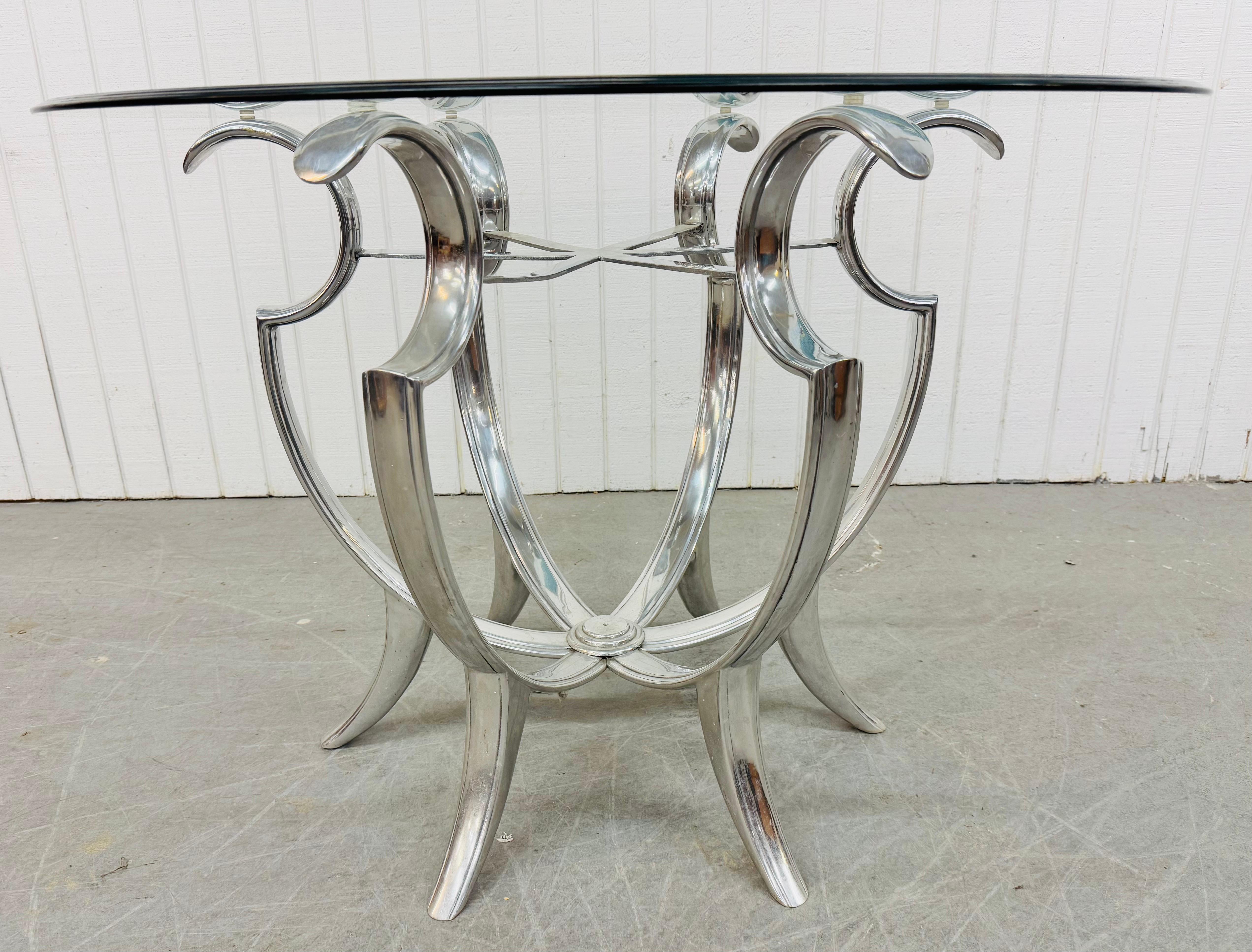 This listing is for a Vintage Hollywood Regency Chrome & Glass Center Table. Featuring a round beveled glass top and sculpted base with chrome finish. This is an exceptional combination of quality and design! 