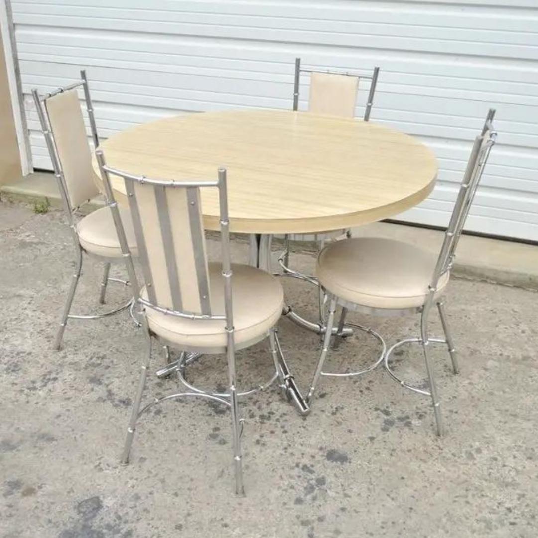 Vintage Hollywood Regency Chrome Metal Faux Bamboo Dining Kitchen Set - 5 Pc Set. Item features a round laminate table top, chrome faux bamboo design, 4 dining chairs, very nice vintage set. Circa  Mid to Late 20th Century.
Measurements: 
Table: