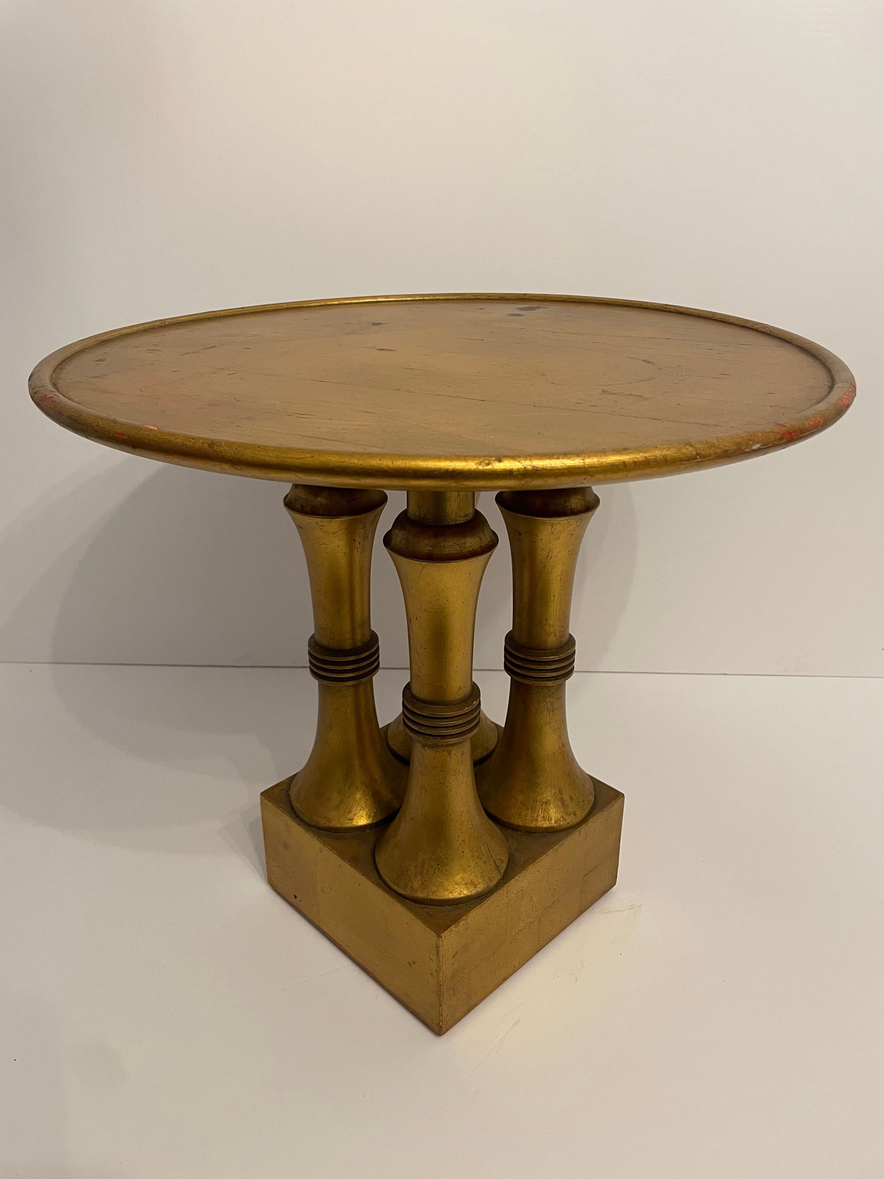 Vintage Hollywood Regency table. Can be used as a great little cocktail or side table. Super chic, one of a kind custom table. Original finish. Has wear on top to gilt finish from age and use. Slight warp to top. Labeled 