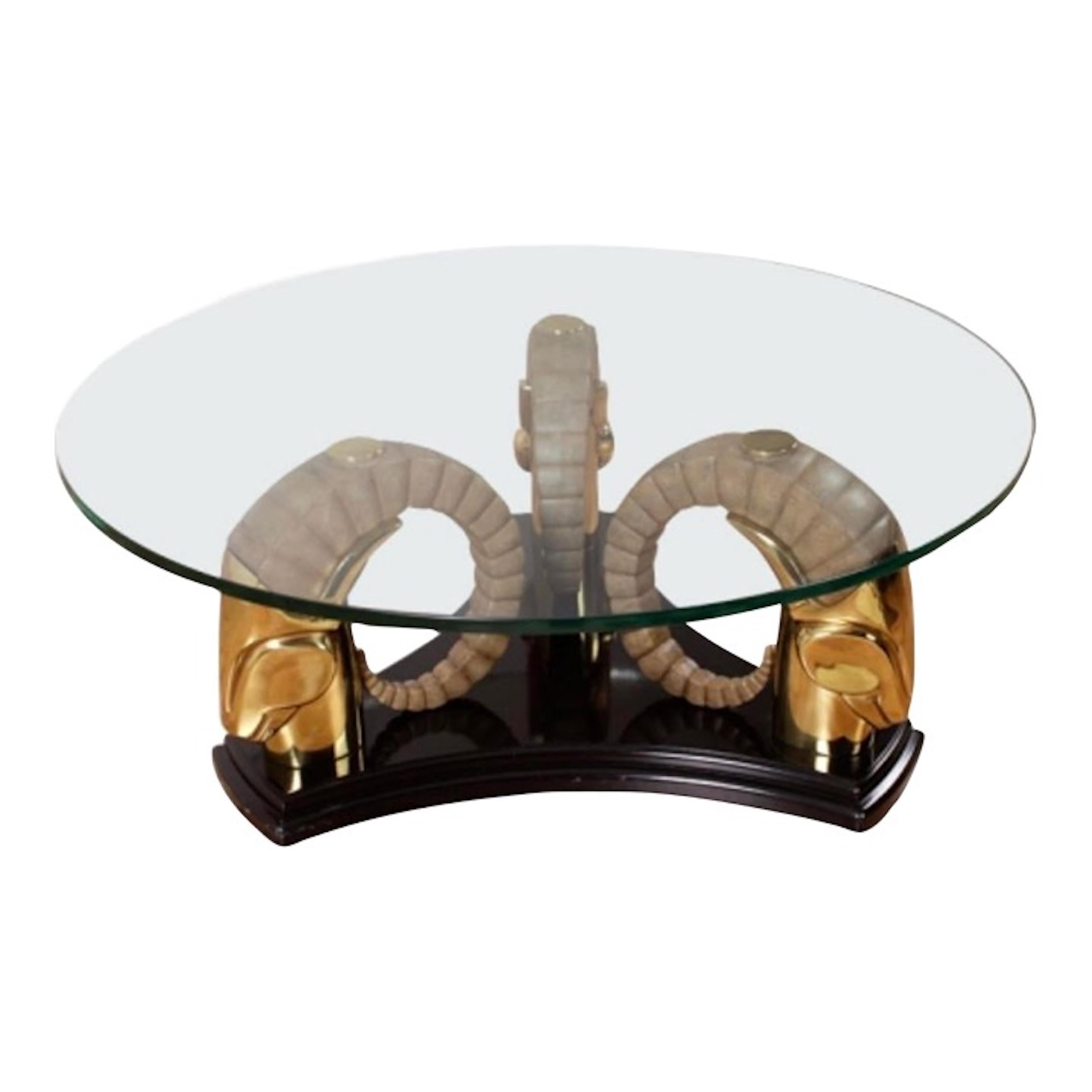 A stylish and elegant piece of furniture that adds a touch of glamour to any living space. Made from high-quality brass, this table base features a stunning ram's head design that exudes a vintage Hollywood Regency vibe. Made by Drexel Heritage.
