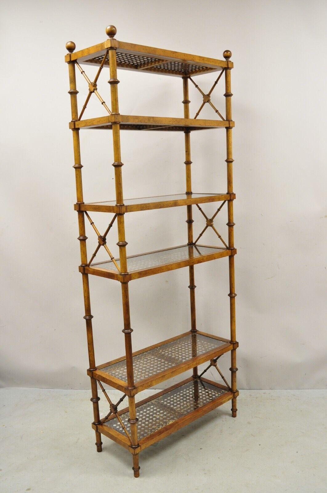 Vintage Hollywood Regency Faux Bamboo Wood & Cane 6 Tier Bookcase Etagere - Pair. Item features 6 tiers with cane and glass surface, x-form faux bamboo design, very nice vintage item, quality American craftsmanship, great style and form.  
Circa Mid