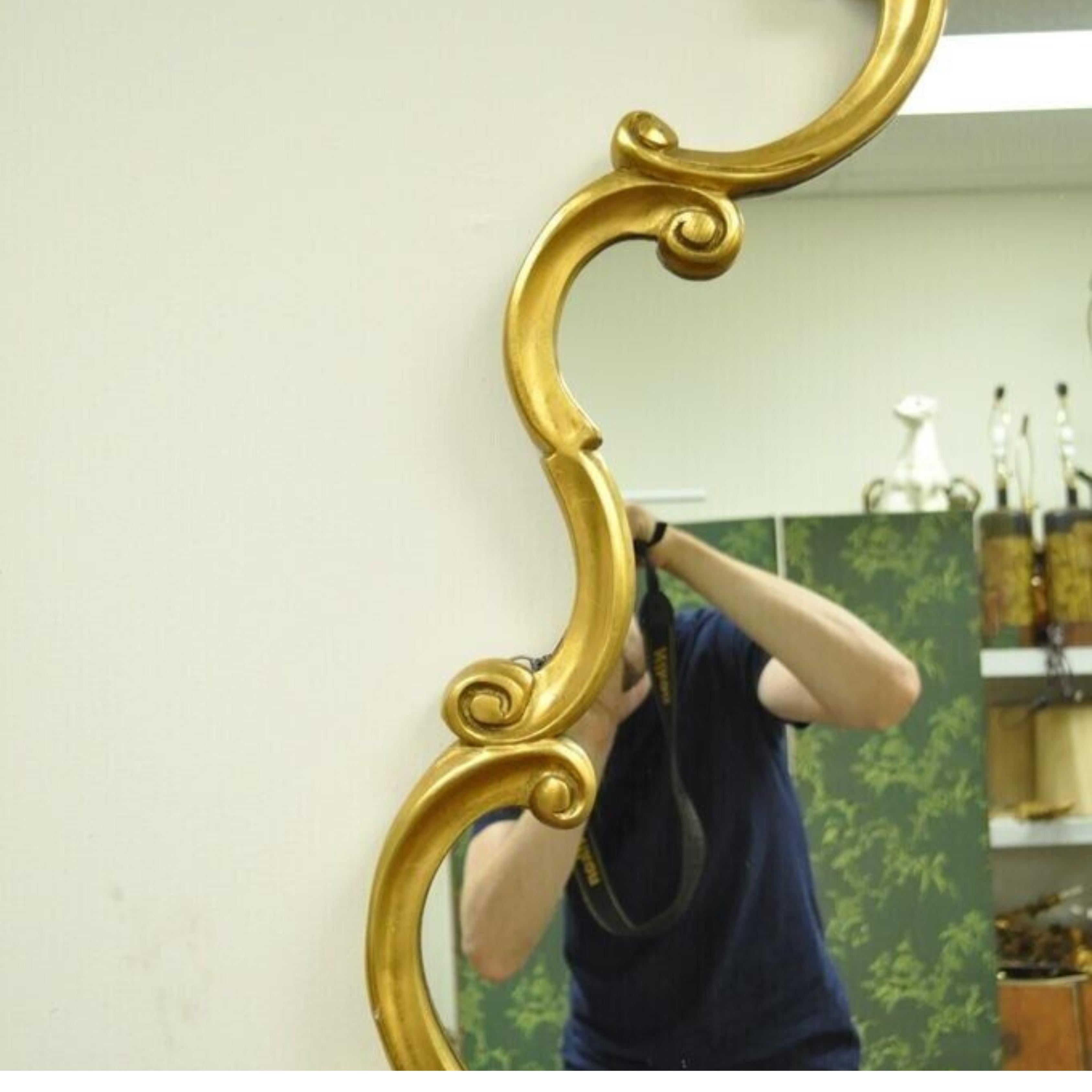 20th Century Vintage Hollywood Regency French Style Gold Carved Wood Scrollwork Wall Mirror For Sale