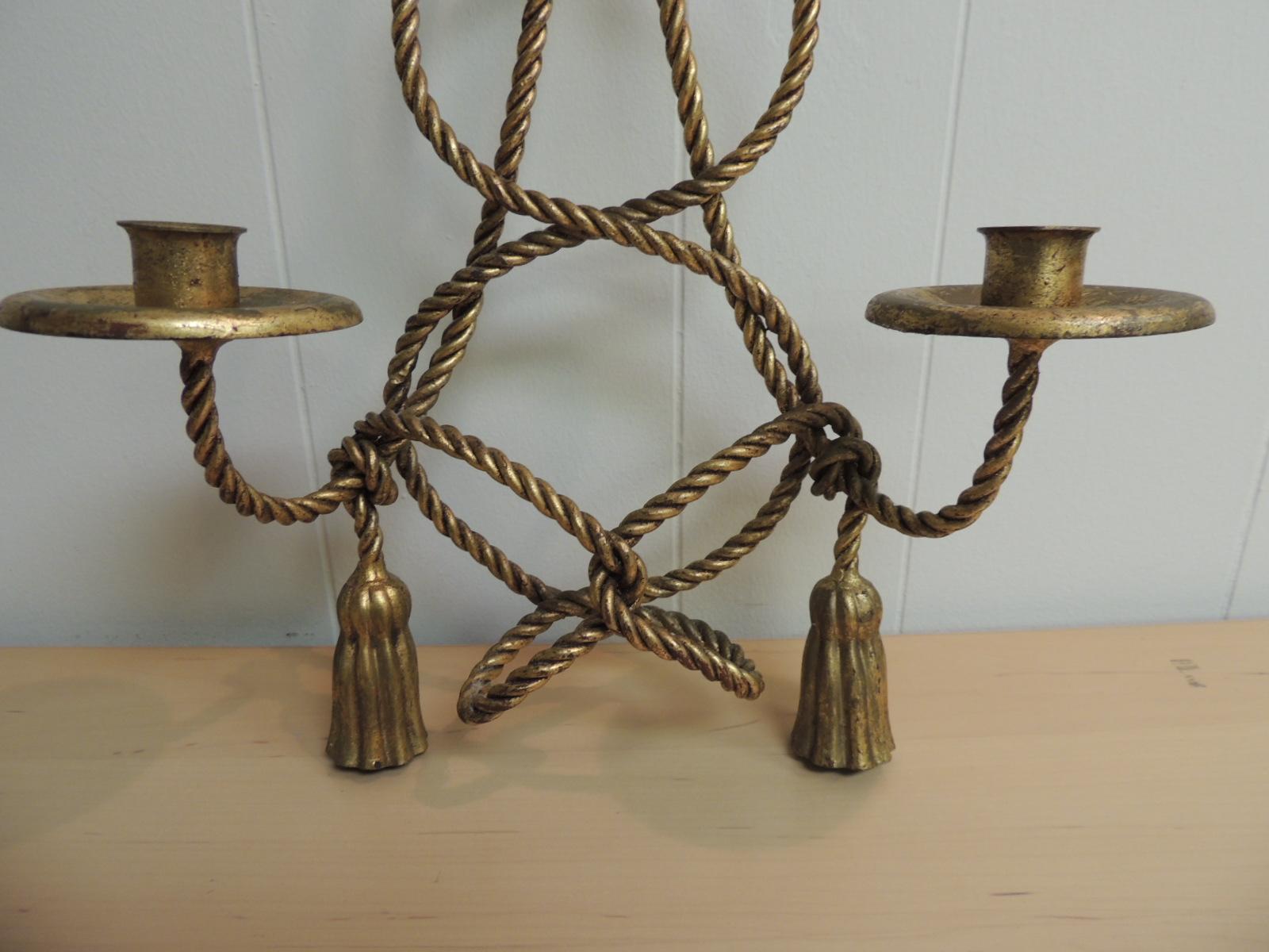 This item is part of our 7Th Anniversary SALE:
Vintage Hollywood Regency gold candle sconce.
Wall sconces with gold leaf finish, twisted rope and tassel design.  Italy, 1940s.
Measures: 13