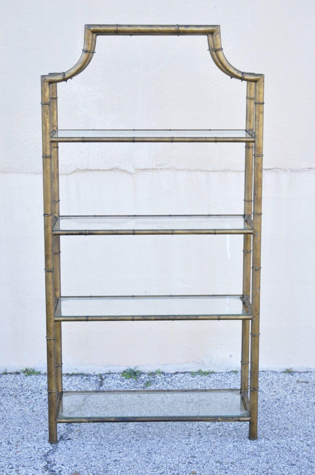 Vintage Hollywood Regency gold gilt iron small faux bamboo pagoda etagere shelf. Item features a unique smaller size, gold gilt metal frame, burnished gold finish, pagoda top, 4 glass shelves, very nice vintage item, great style and form. Circa