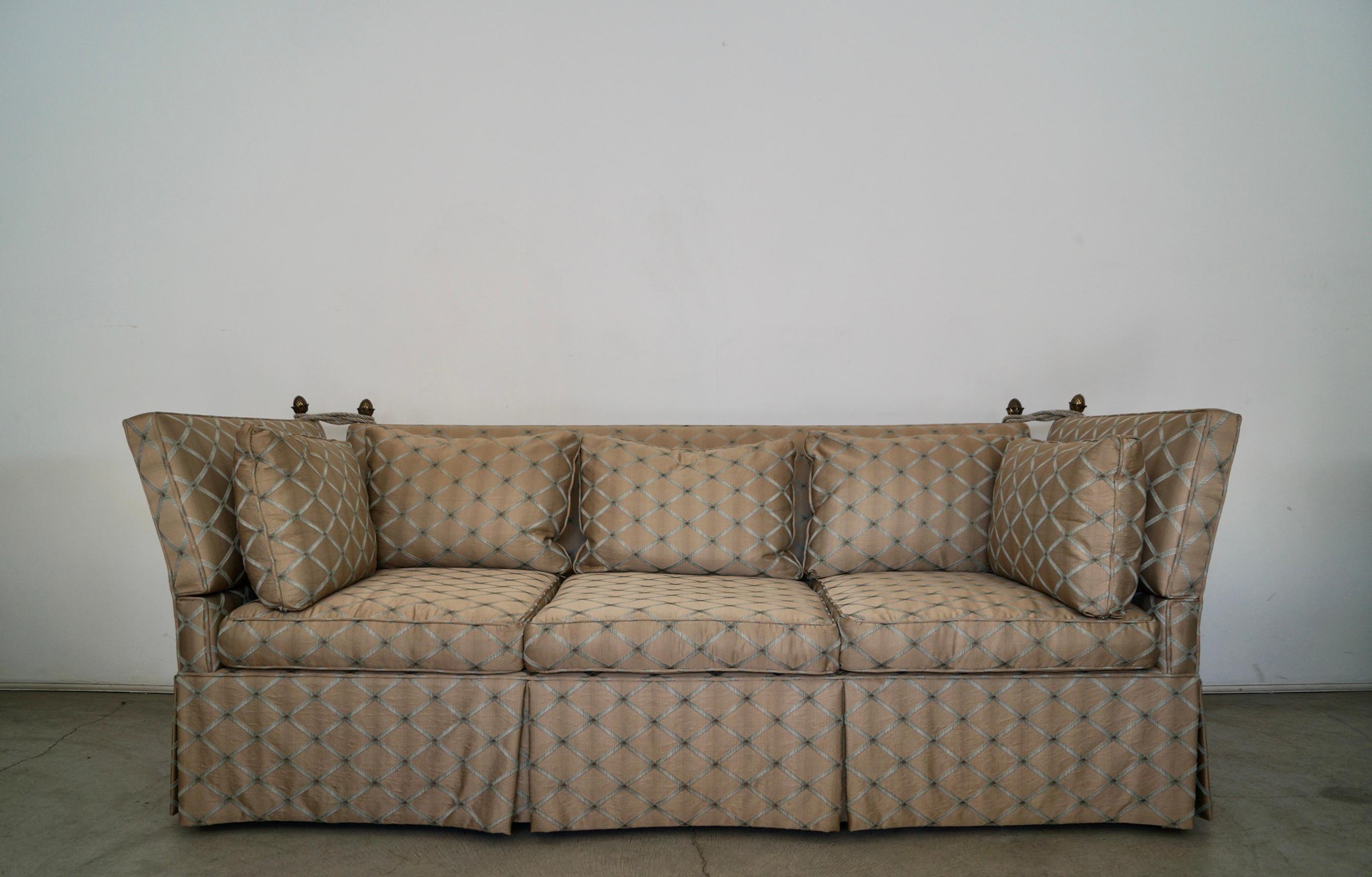 Vintage Hollywood Regency Knole couch for sale. This was is from the 1950's, and was previously reupholstered in silk with a beautiful pattern. It's a taupe tone with a raised textured teal and dark brown. This sofa is a high-quality designer Knole