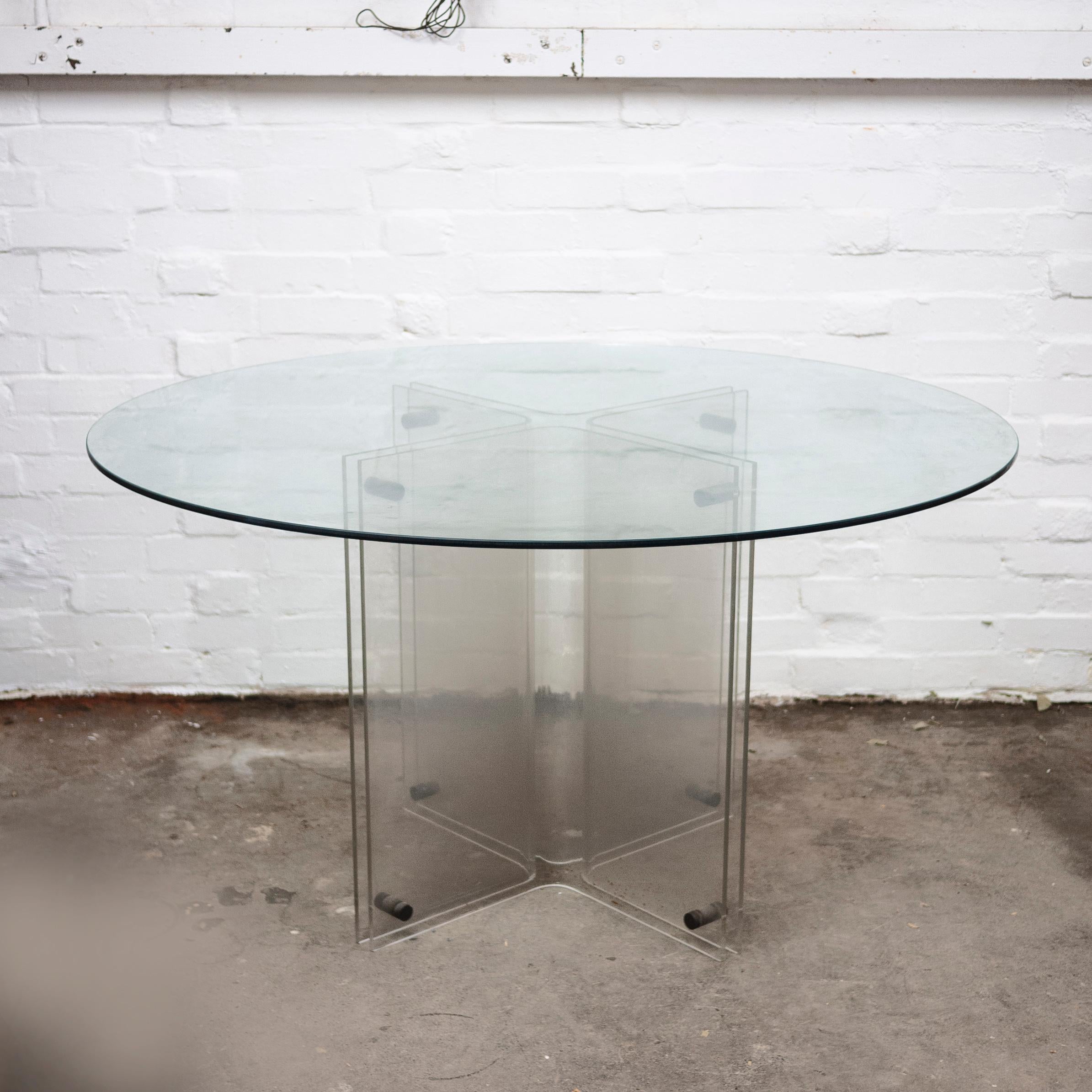 A glass and lucite dining table with a pedestal base in the style of hollywood regency.

Manufacturer - Unknown

Design Period - 1980 to 1989

Style - Hollywood Regency

Detailed Condition - Good with minimal defects.

Restoration and