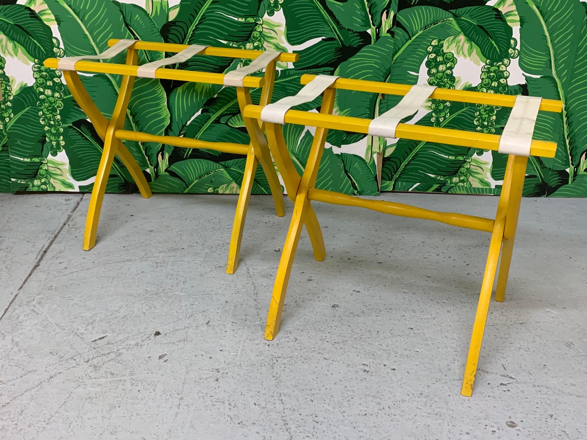 Vintage luggage racks in the style of Dorothy Draper finished in a cheery, bright yellow. All original. By Scheibe. Good vintage condition with only very minor imperfections consistent with age. Price is per rack.
