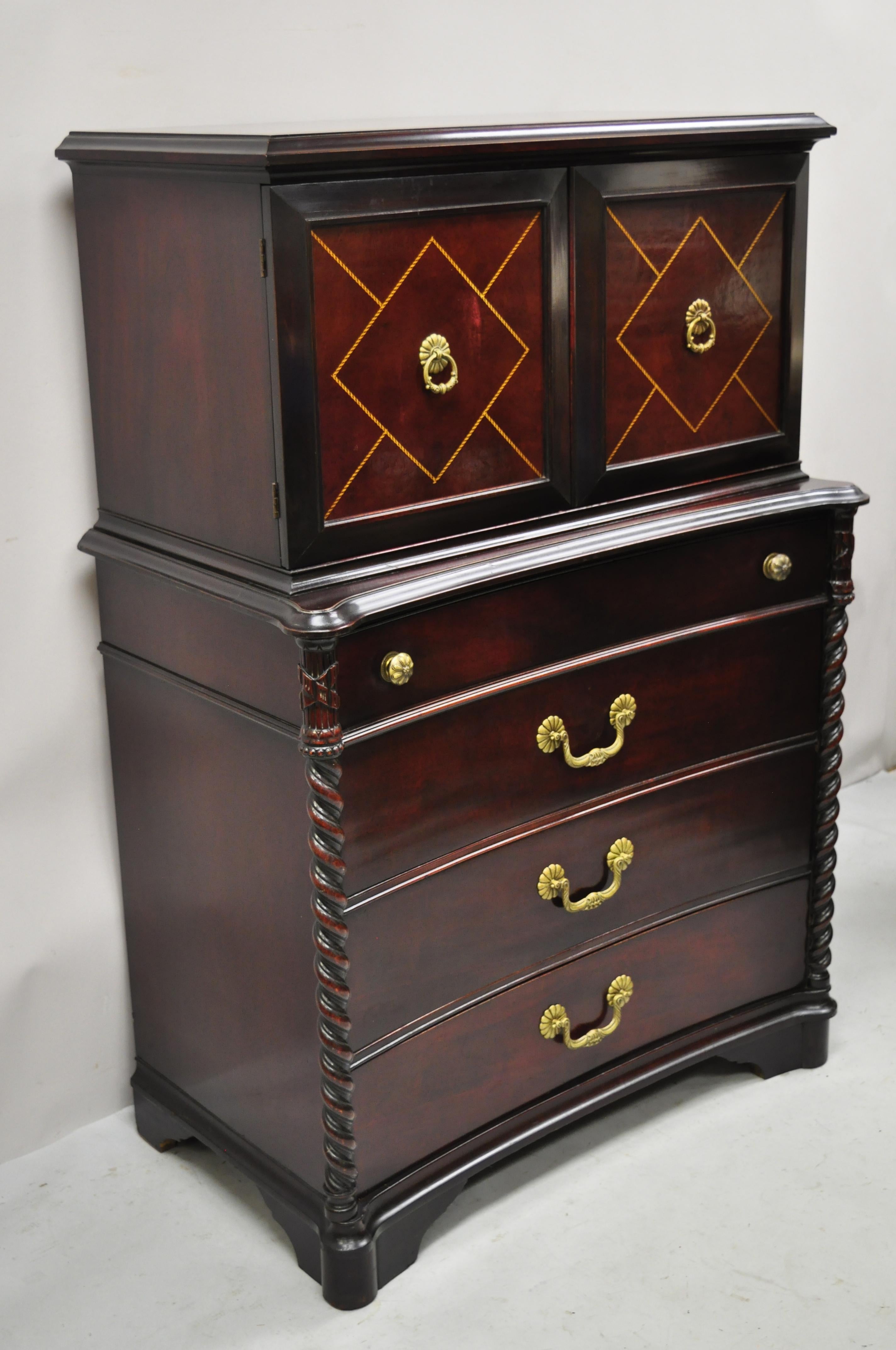 Vintage Hollywood Regency mahogany leather door tall chest on chest dresser cabinet. Item features custom glass top, leather doors, spiral carved twisted columns, 8 dovetailed drawers, solid brass hardware, quality American craftsmanship, great