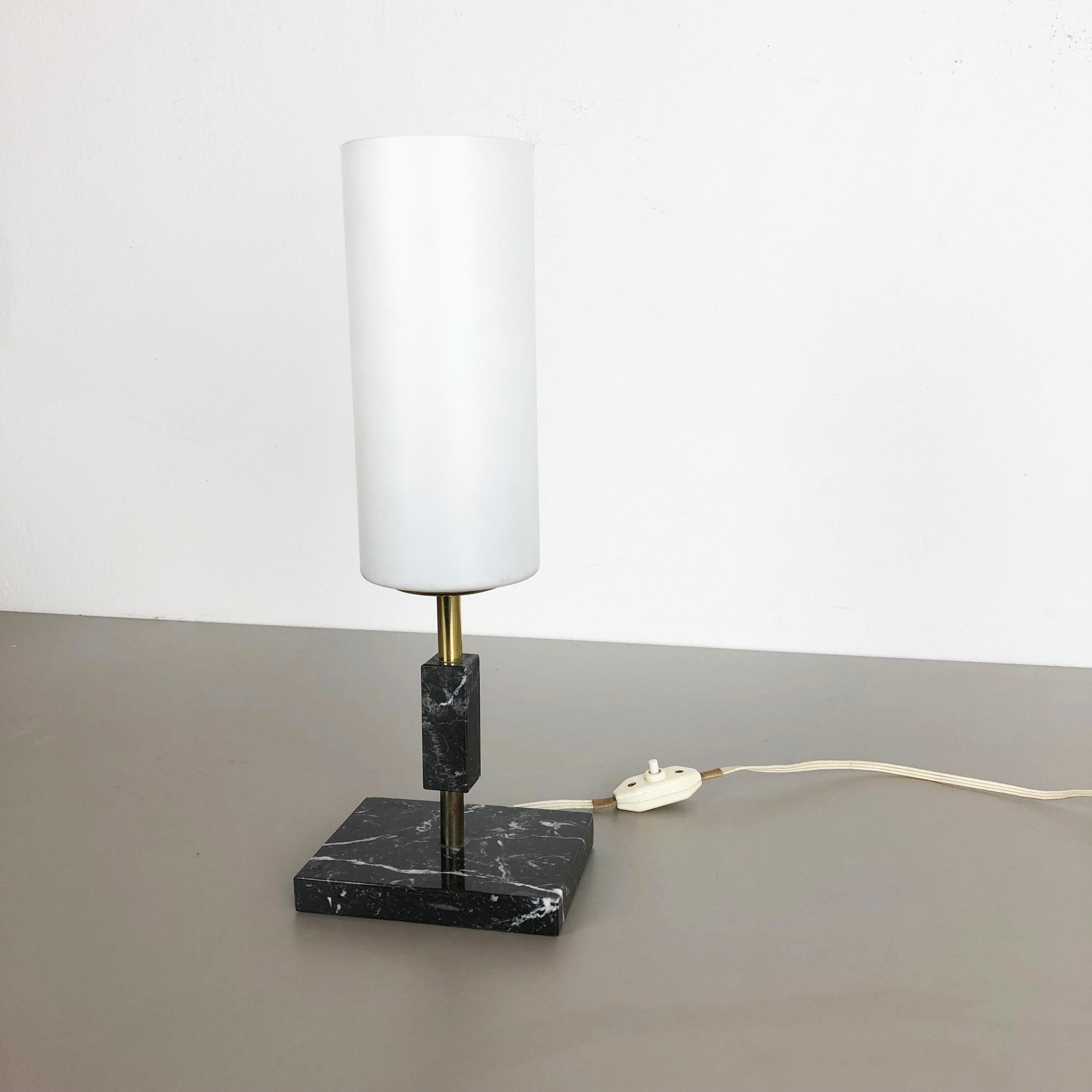 Article:

Impressive marble table light with opal shade


Origin:

Italy


Decade:

1950s



Description:

This original vintage light is made of high quality black marble with tube shaped white opal glass shade at the top. The