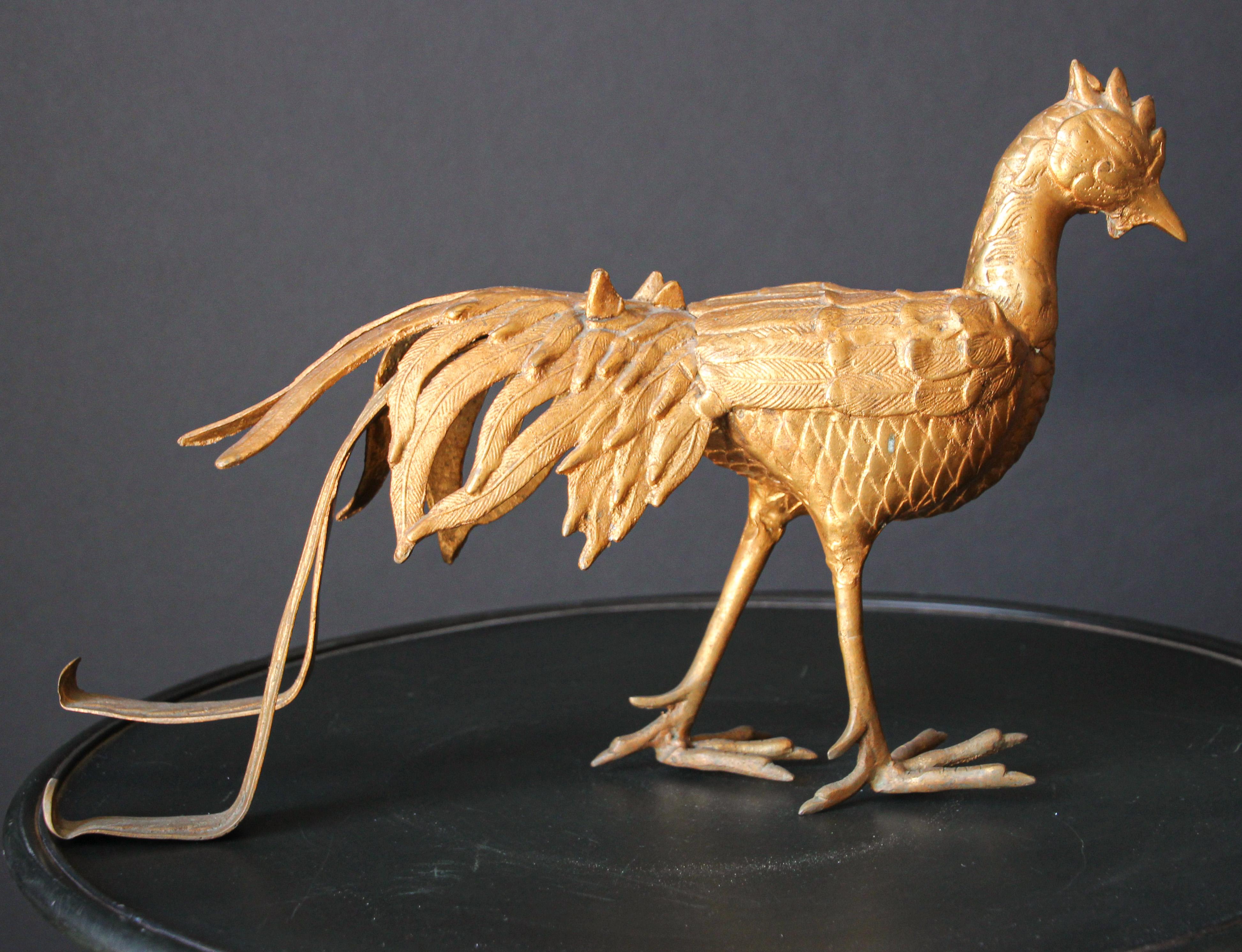 Large Hollywood Regency brass peacock statue or sculpture. 
Midcentury Anglo-Indian cast brass peacocks
This animal statue or figure would make a great addition to a midcentury or Hollywood Regency interior.
Asian bronze sculpture casted using