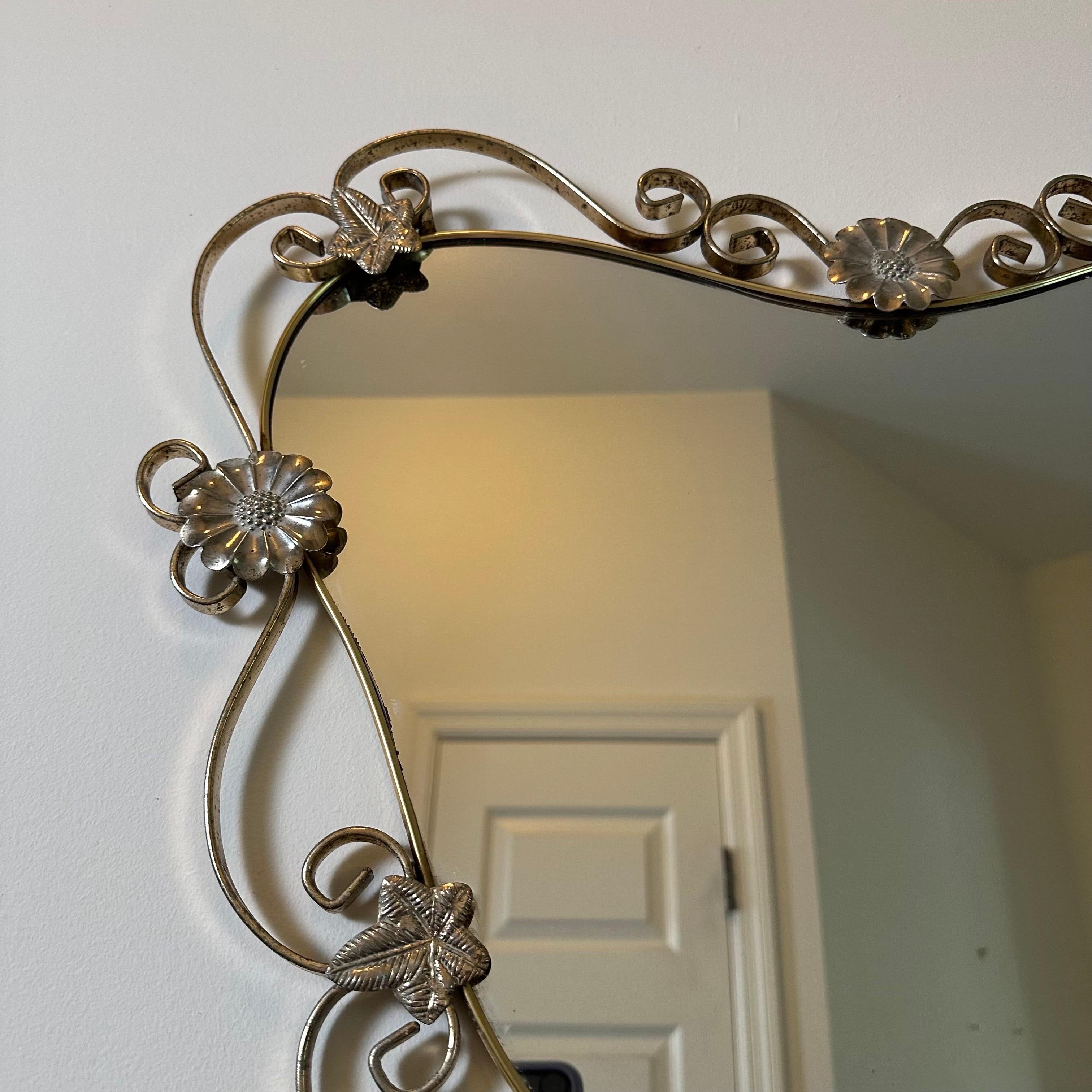 Vintage Hollywood Regency Mirror in Brass and Steel with Flower and Scroll Frame In Fair Condition In Amityville, NY