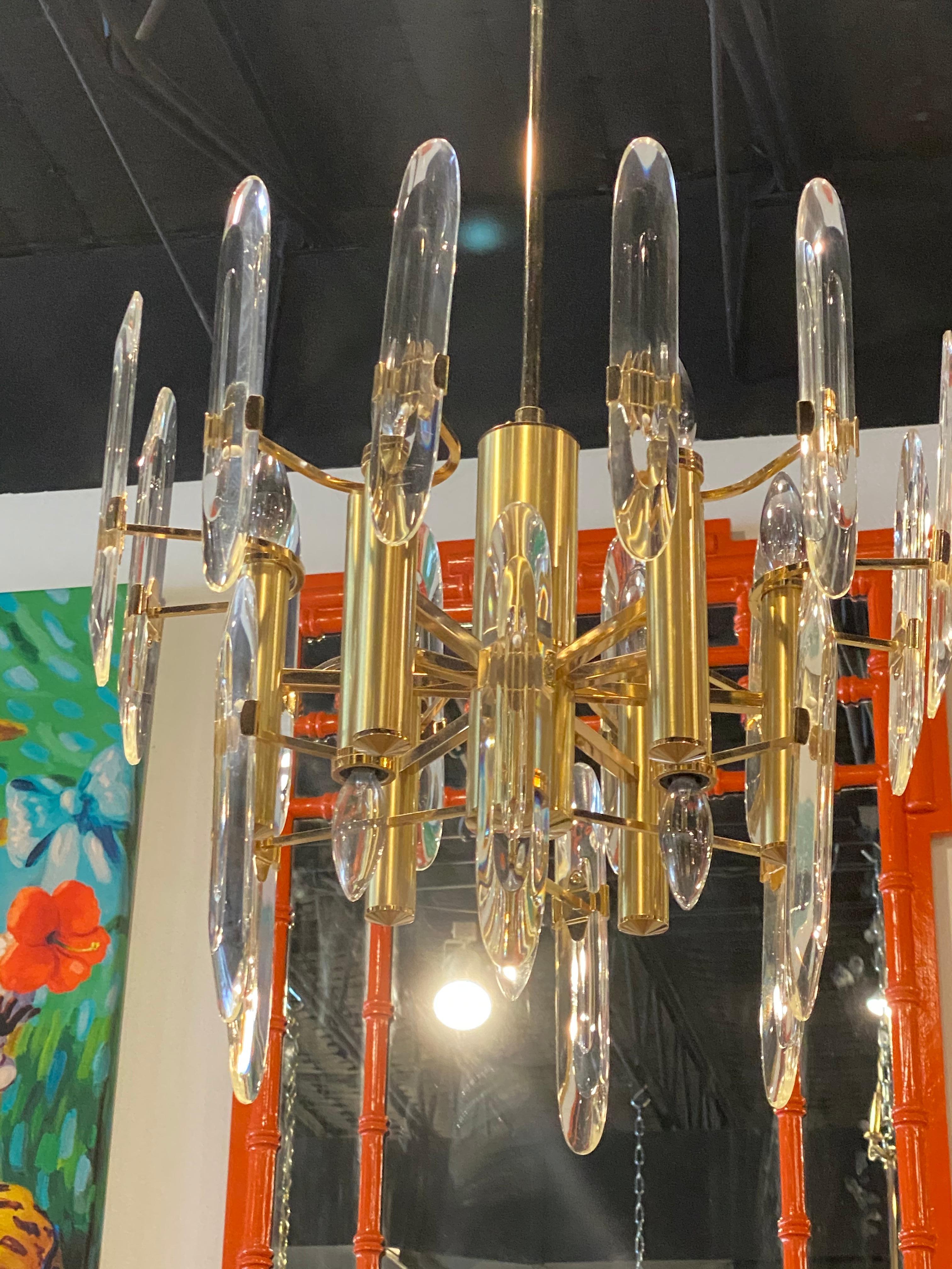 Vintage Sciolari brass and glass chandelier. 9 lights. Comes with original ceiling canopy. Matching pair available. Listed separately.