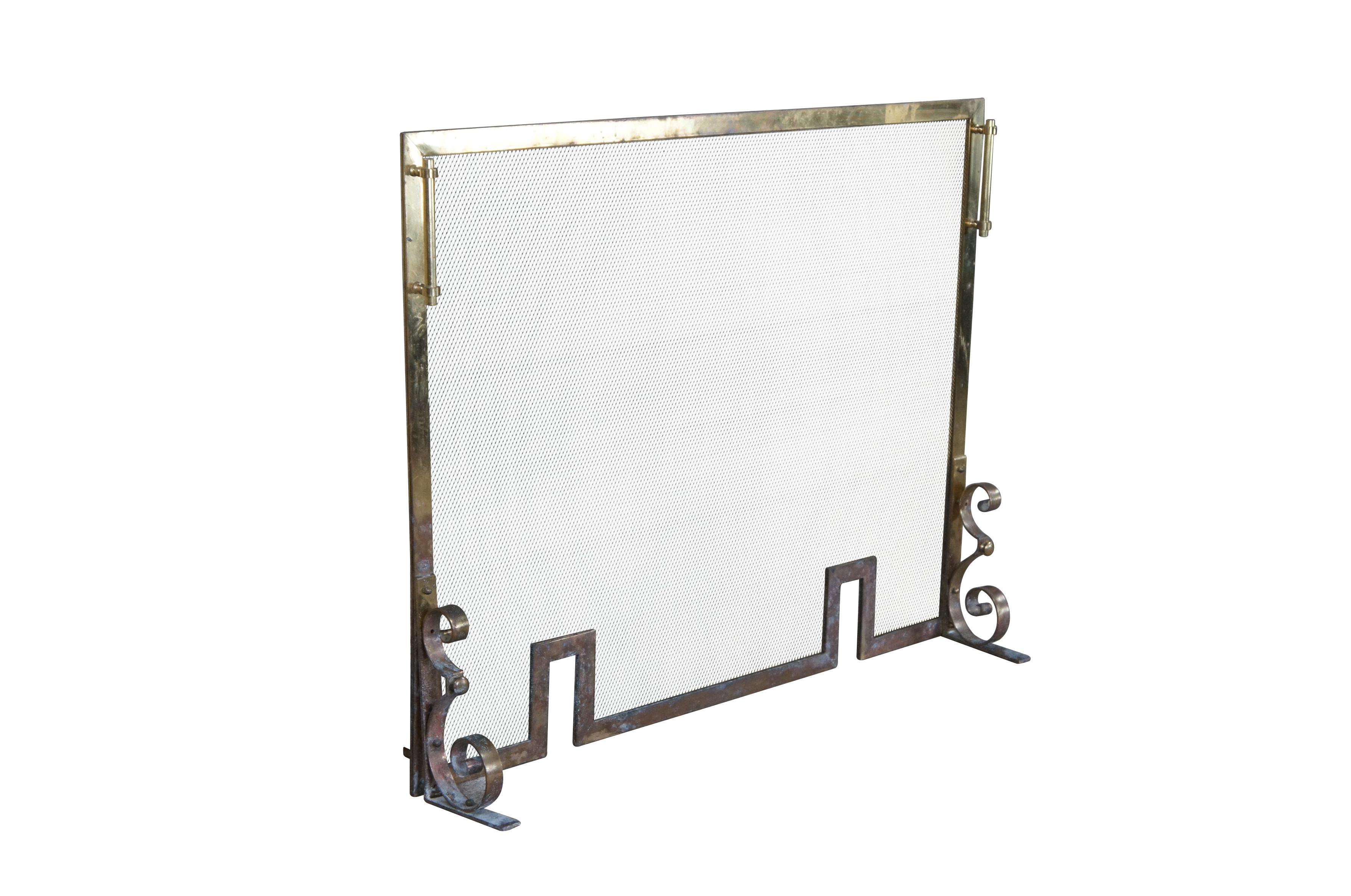 Vintage brass and mesh fire screen featuring Hollywood Regency styling with scrolled brass accents and slots for firedog andirons.

Dimensions:
37