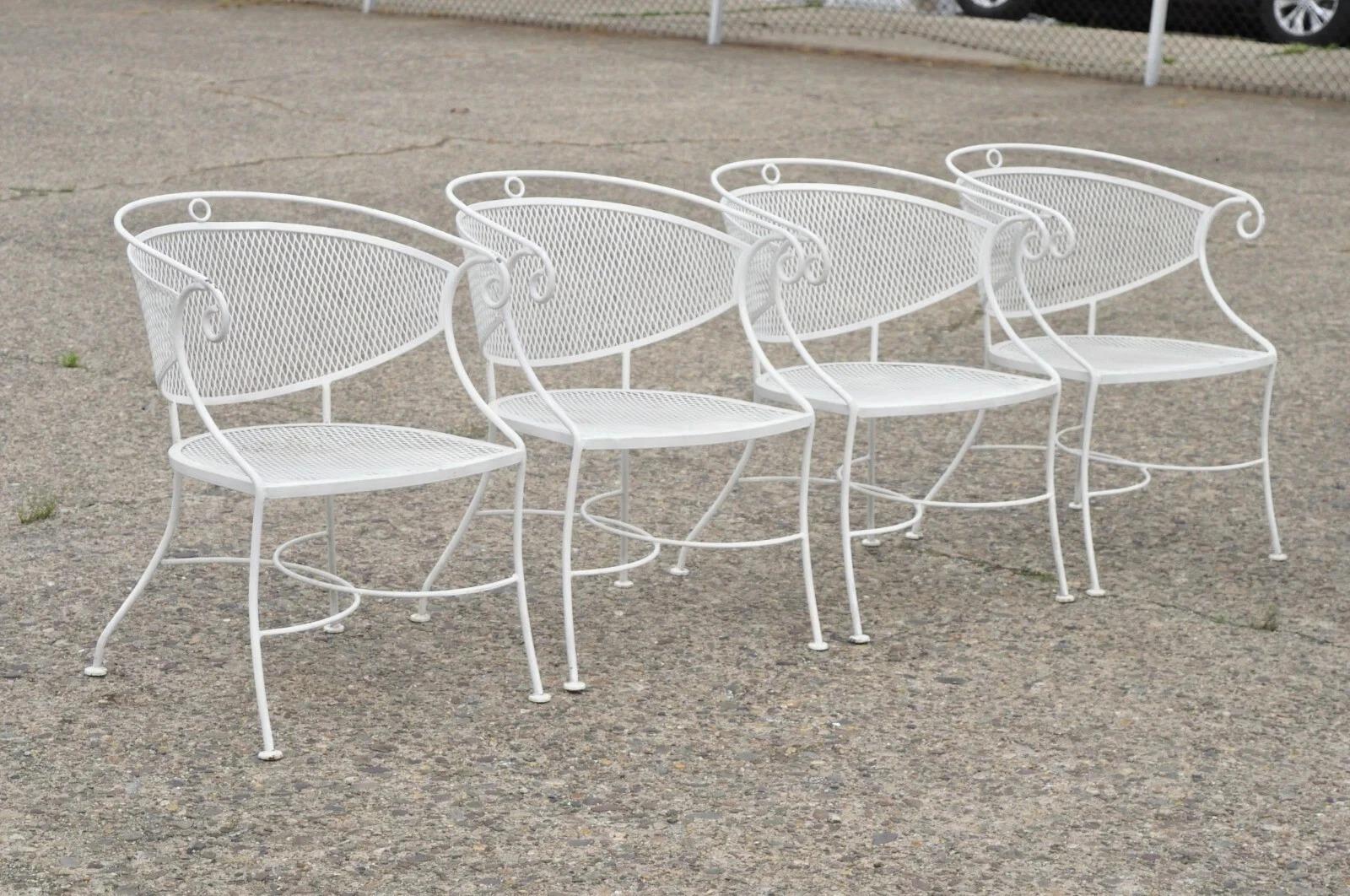 Please message us with your zip code to request a more reasonable domestic U.S. shipping quote.

Vintage Hollywood Regency Scrolling Wrought Iron Barrel Back Patio Dining Armchairs - Set of 4. Item features (4) armchairs, scrolling frames, barrel
