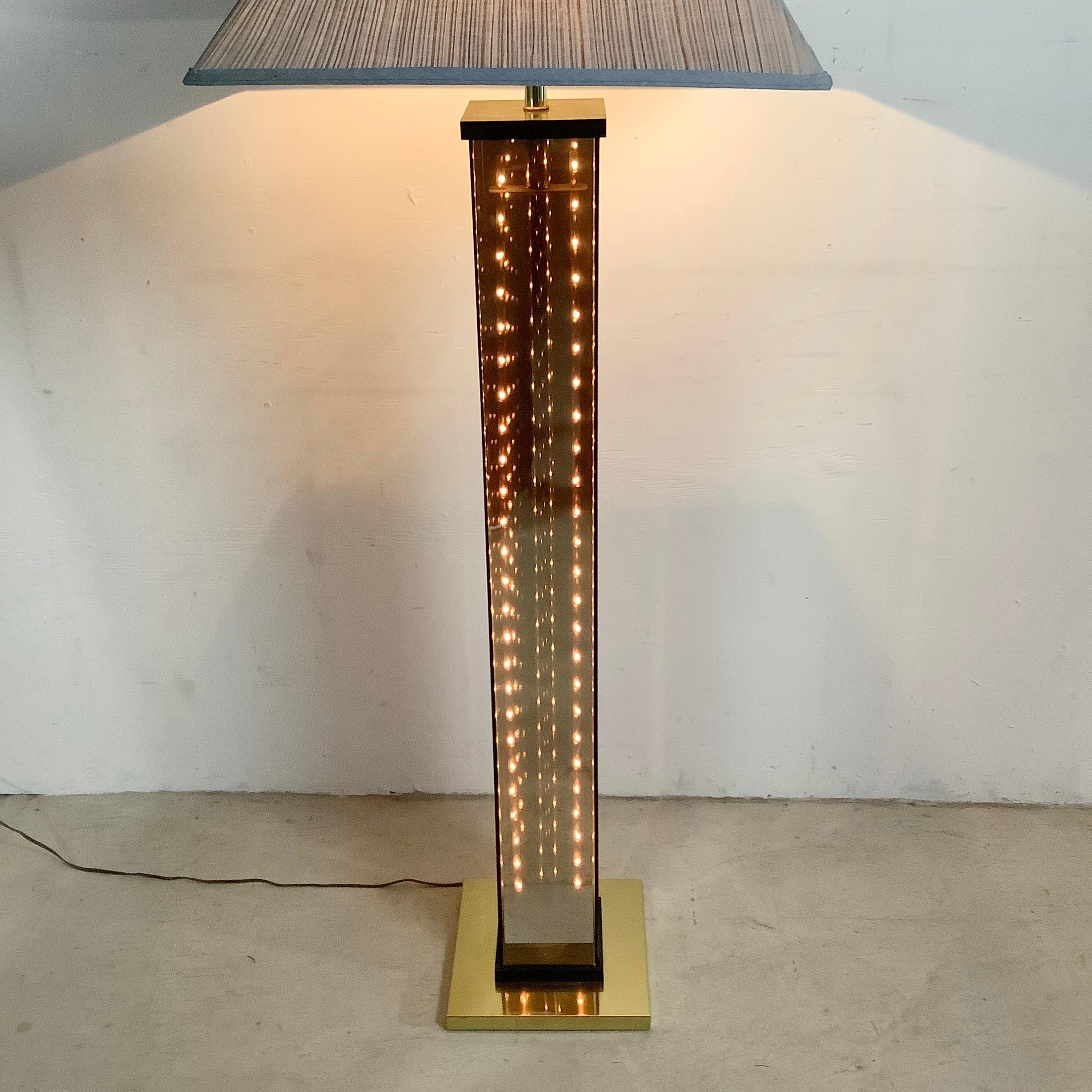 This stylish vintage modern floor lamp features a unique Gaetano Sciolari like style with brass finish base and smoked glass sides- the three way light switch allows you to choose between the upper lamp only, interior runner lights only, or both