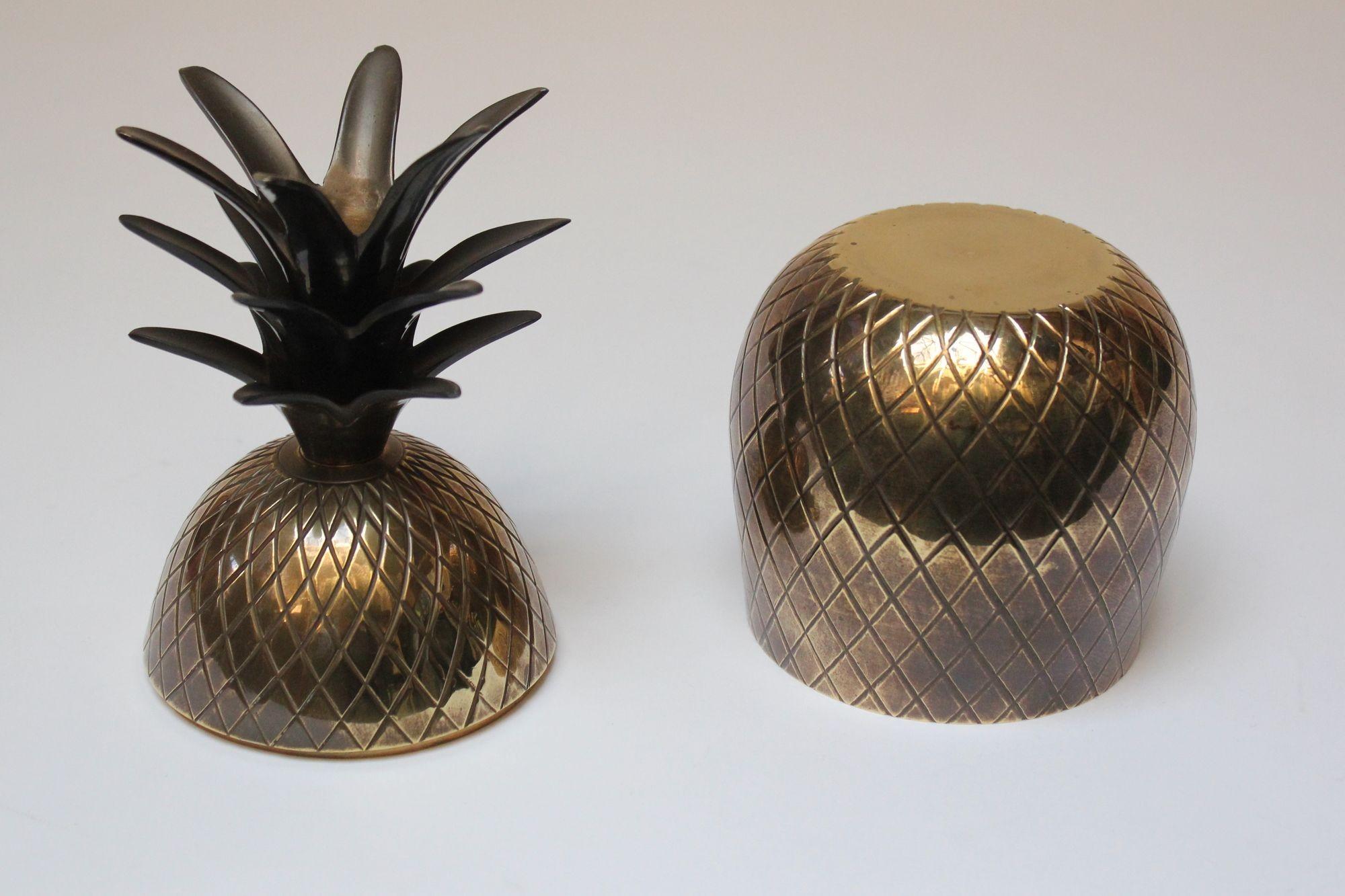Sculptural brass pineapple-form trinket jar with natural, warm patina (circa 1970s). Sourced in Rome, Italy.
Dense, quality production, differing from flimsy, later examples of the same concept.
Good age with interior scuffs, spots of