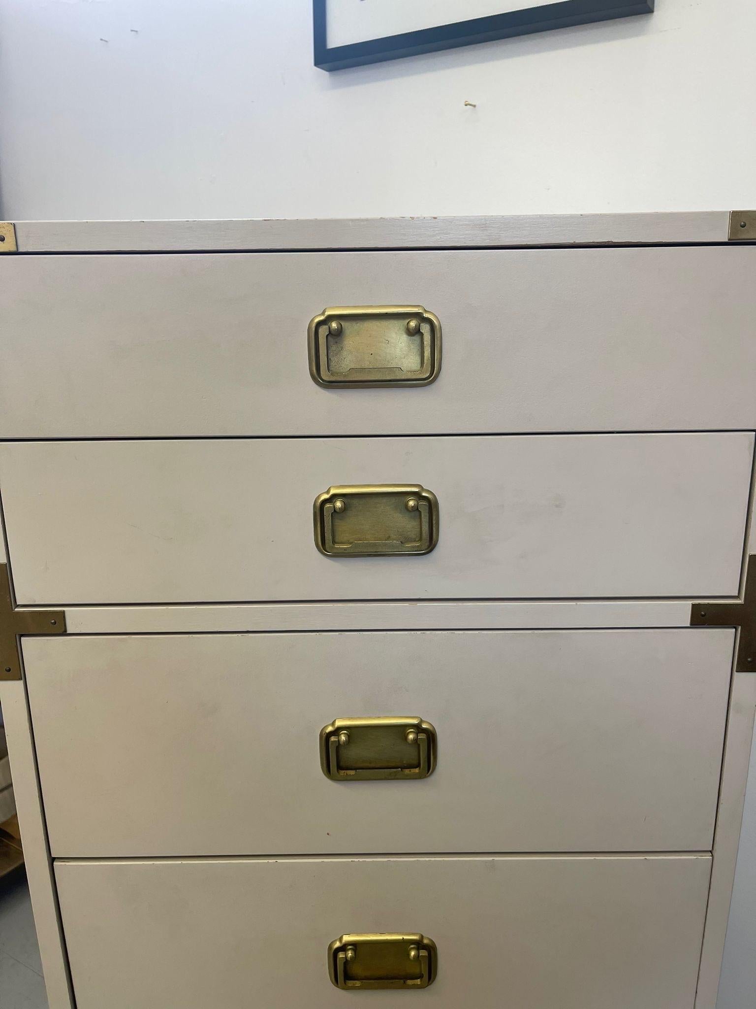 Vintage Hollywood Regency White and Gold Campaign Style Dresser Cabinet. In Good Condition For Sale In Seattle, WA