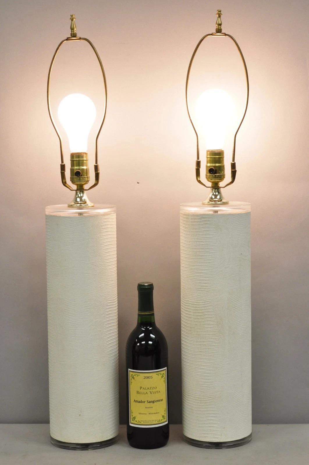 Vintage Hollywood Regency White Faux Alligator Embossed Cylinder Table Lamps with Lucite Accents by Optique - a Pair. Circa Late 20th Century. Measurements: 30