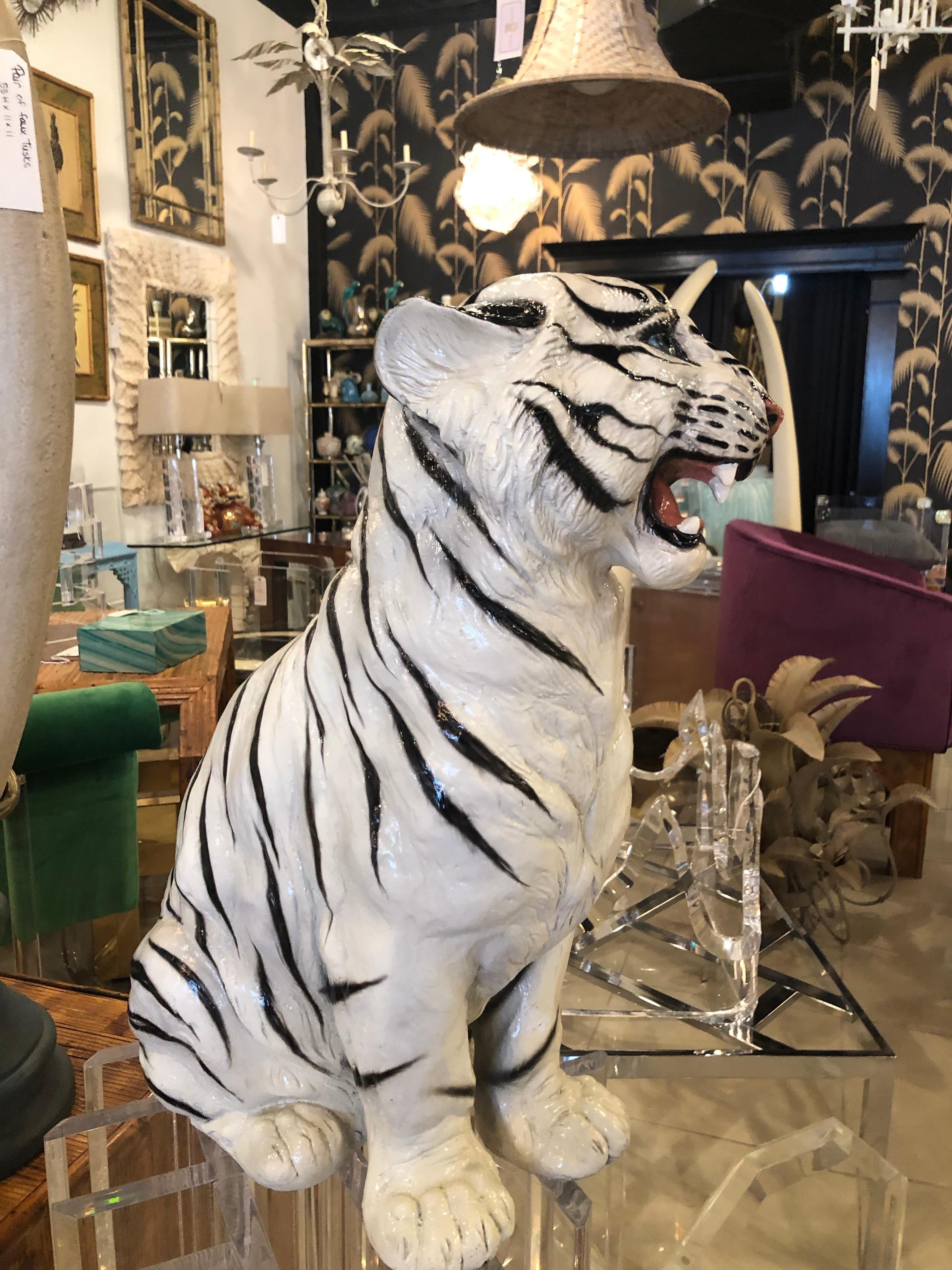 Vintage white and black tiger statue. He is made of some sort of composite and is heavy. No chips or breaks.