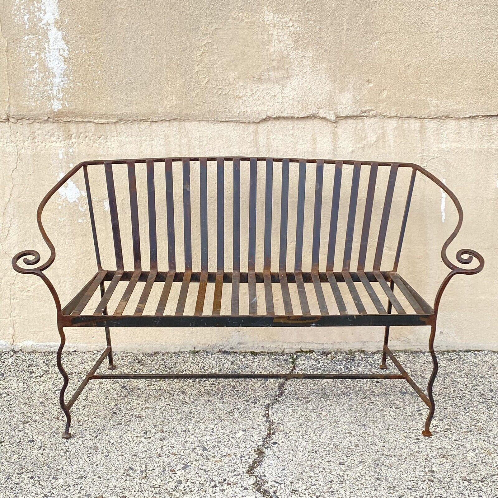 Vintage Hollywood Regency Wrought Iron Scrolling Garden Patio Loveseat Bench. Circa Late 20th Century. Measurements: 31