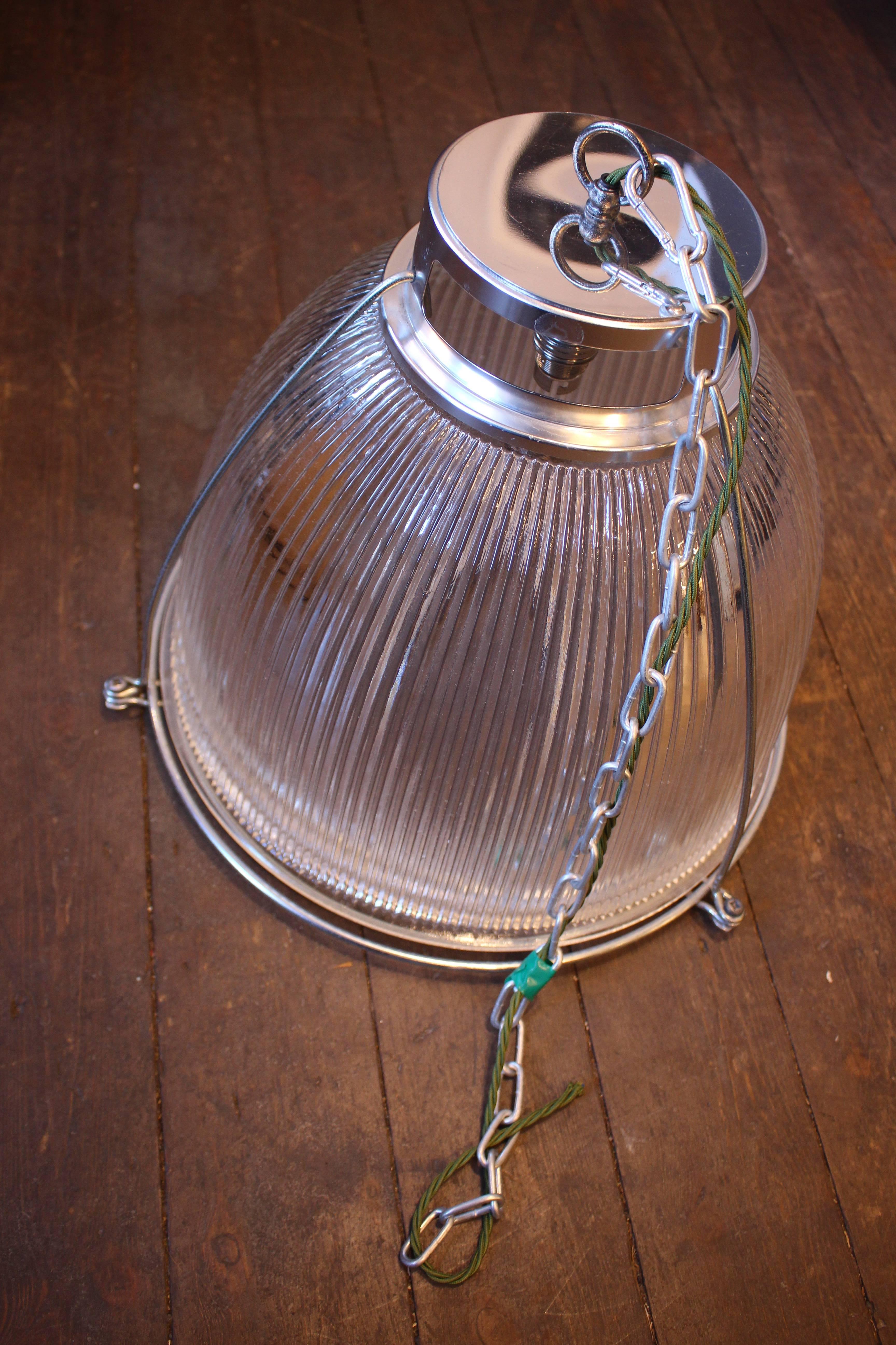 These beautiful vintage commercial grade Holophane ceiling lights are a design Classic. Reclaimed from a factory, re-polished and rewired we have around 50-60 left. Measures: 41 cm diameter with a 36 cm drop with a bayonet cap bulb fitment BC or