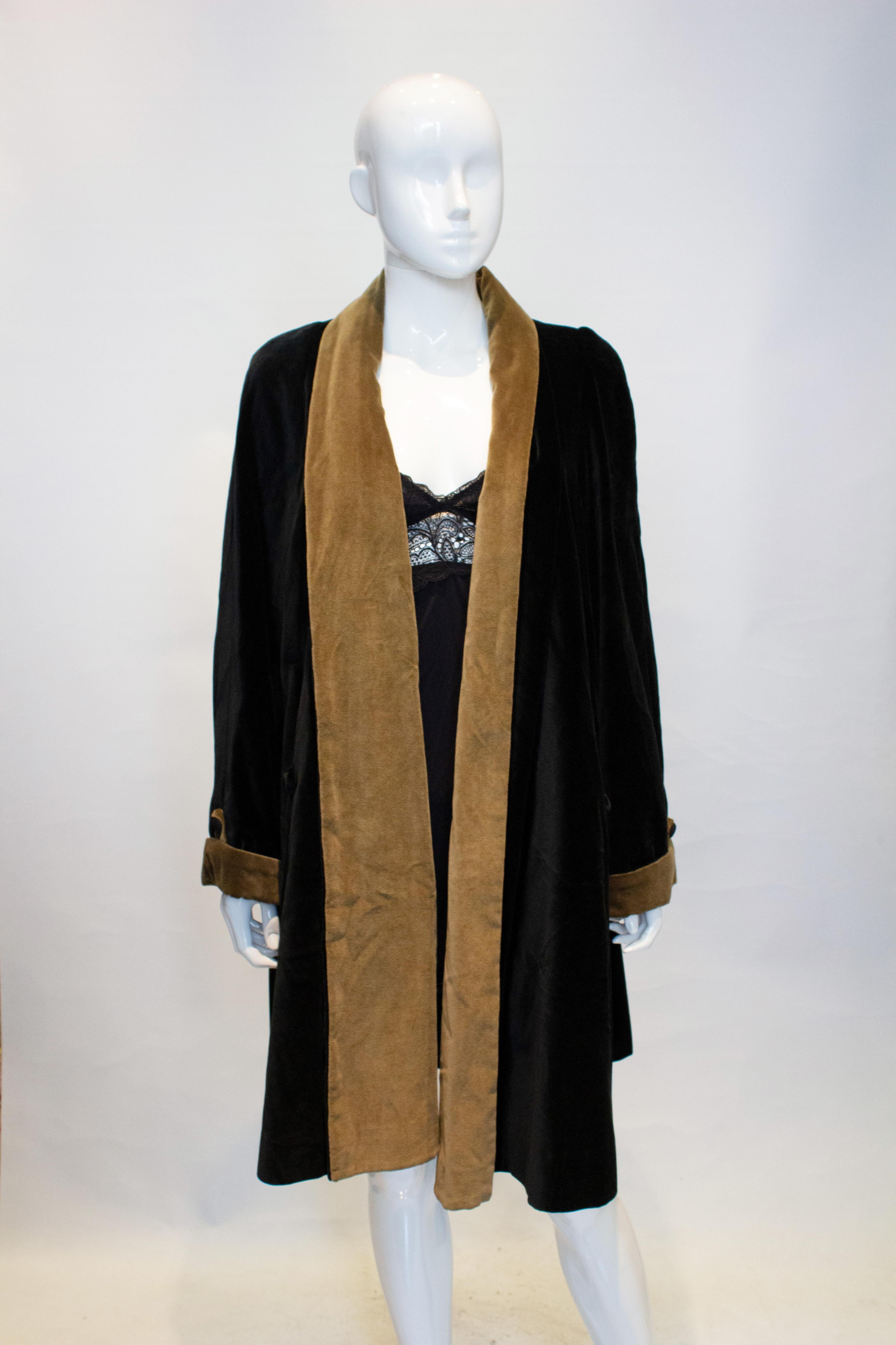 A wonderful vintage velvet coat by Holroyde. In black with a sage green collar and cuffs, with wonderful detail. The coat is A line , fully lined and hangs beautifully.
Measurements: Bust up to 42'', length 43''