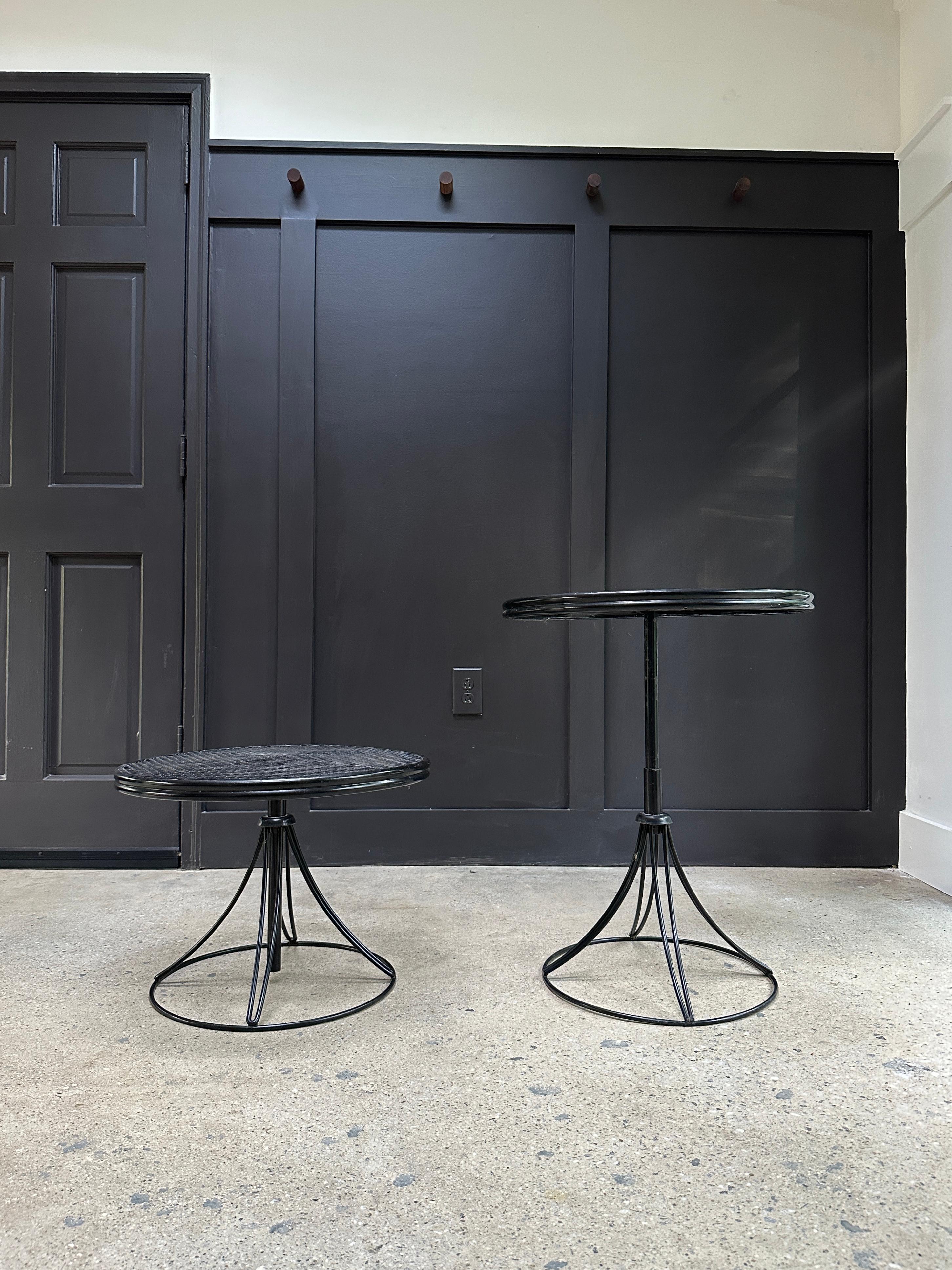 Adjustable tables of wrought iron and metal mesh, made by Homecrest, circa 1960s.

Tables feature an adjustable center pole, allowing the height to extend from a coffee table height to dining height.

Recently powder coated. Price is for the