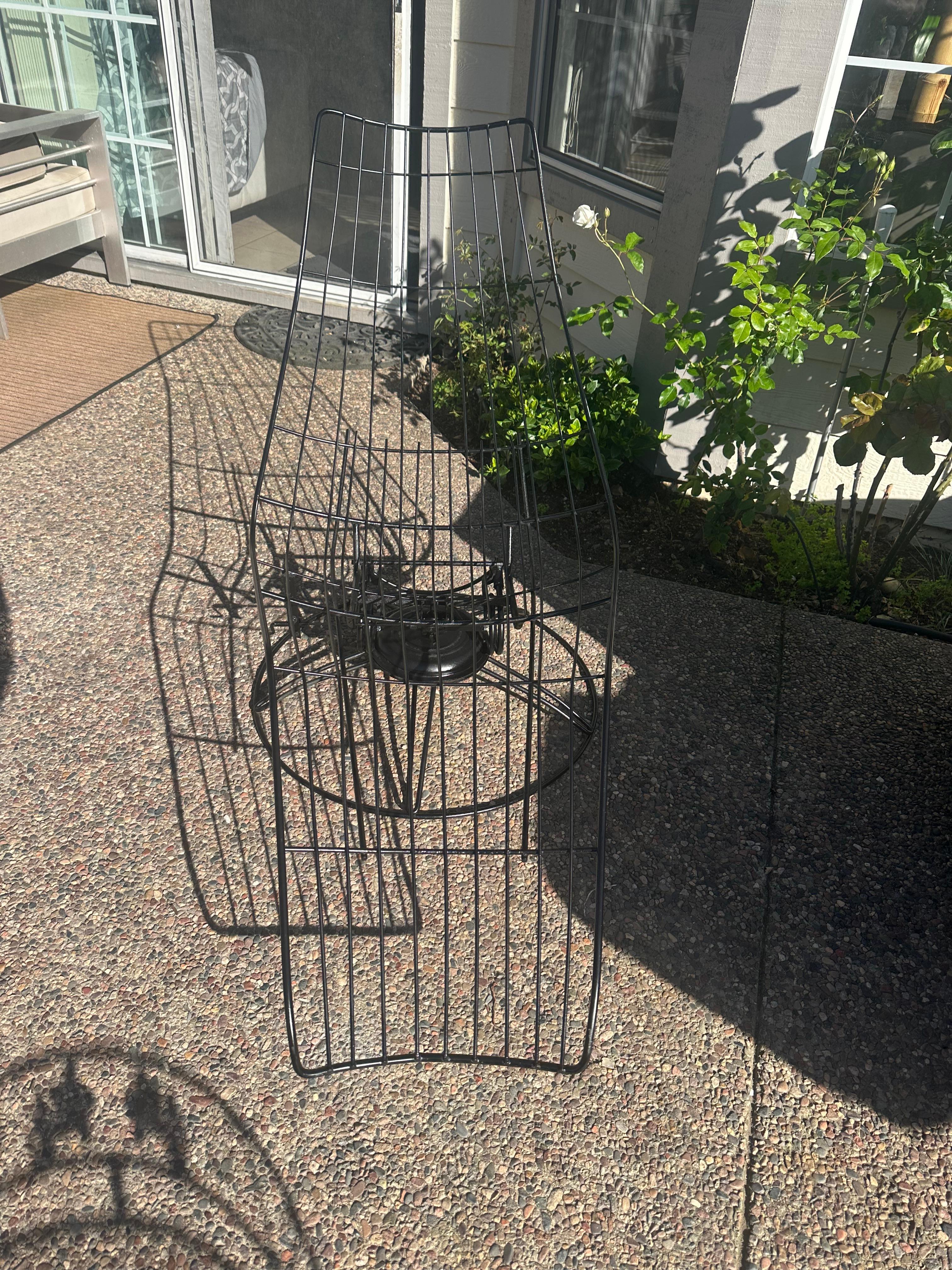 Homecrest Siesta Bottemiller banana chaise lounge chair.
Works great still
made of Wrought Iron
it swivels and rocks

just spray painted black

clean modernist lines of wrought iron design and swivel and spring seat, 
No makers mark , tags or