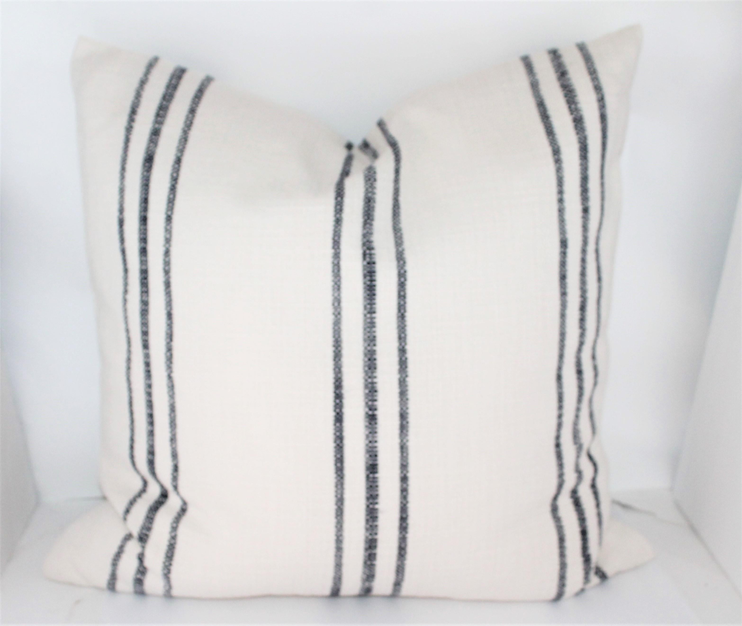 Antique homespun thick soft linen ticking pillows with blue stripes. The condition is pristine. Sold as a pair.