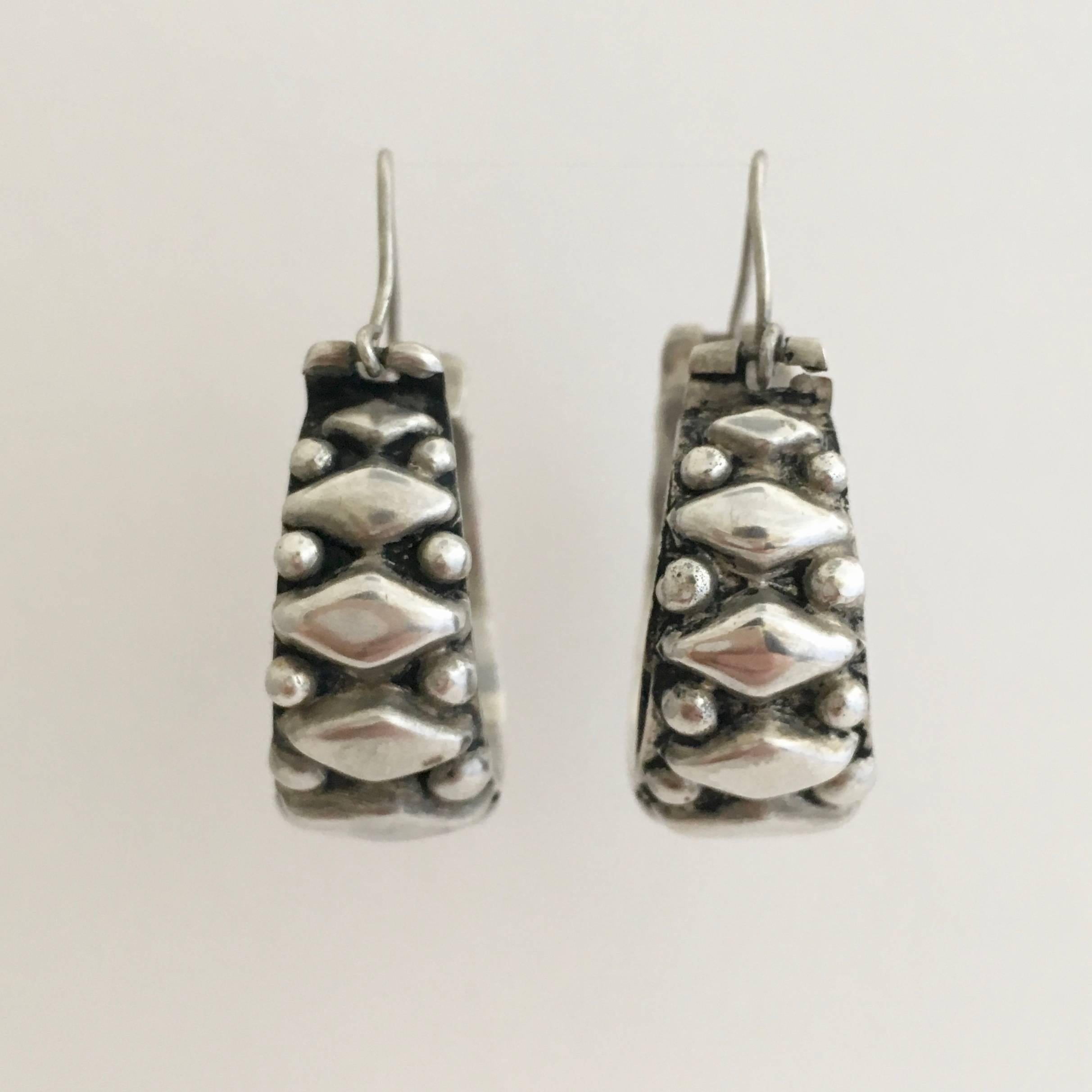 A fantastic pair of chunky silver hoops with an authentic folk feel. Earrings like these never go out of fashion. They are a generous, yet wearable size at 4cm high with a diameter of 3cm. Each earring is stamped with 925. 
