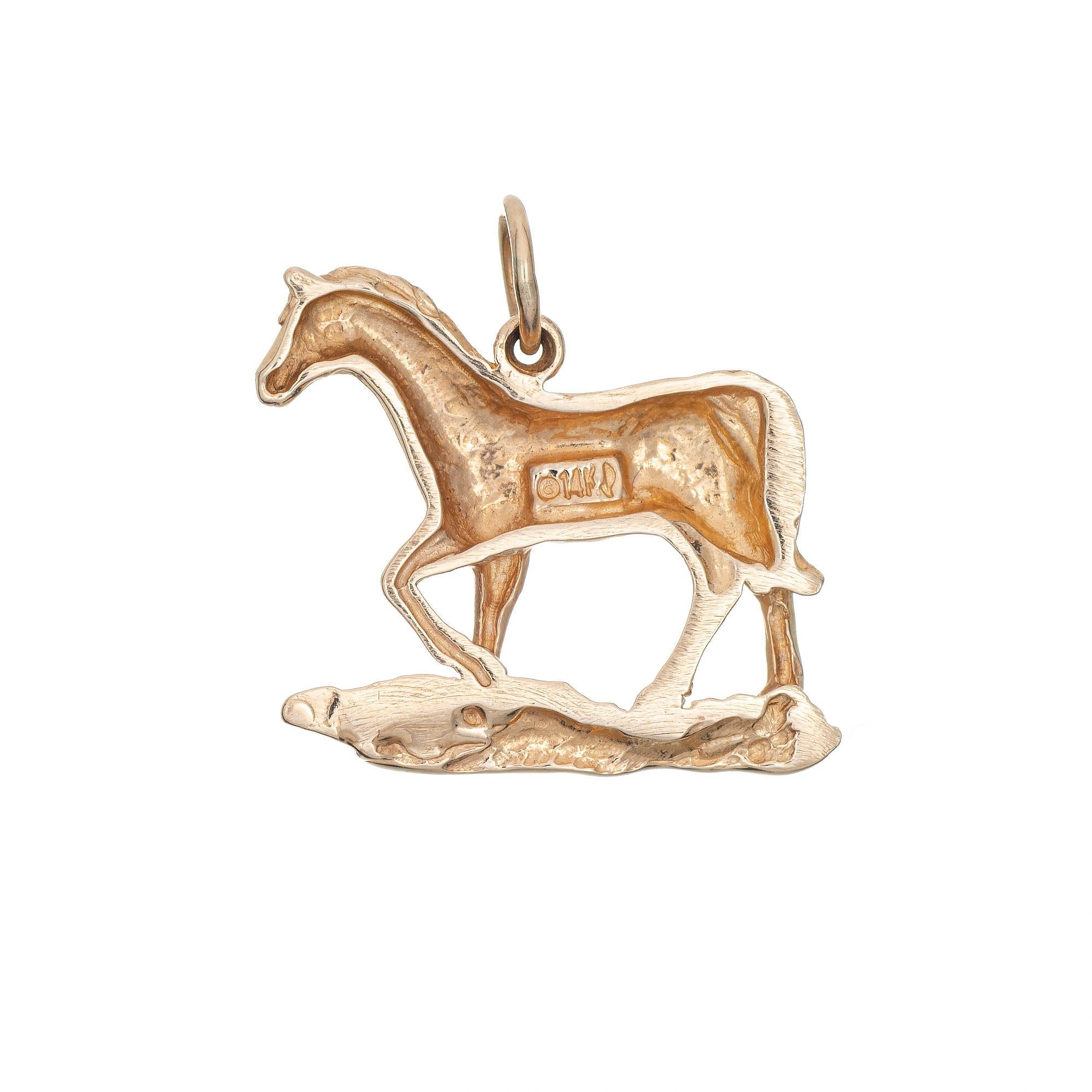 Finely detailed vintage horse charm crafted in 14k yellow gold.  

The trotting horse is smaller in scale (3/4 inch diameter) and great worn on a charm bracelet or as a pendant.

The charm is in very good condition and was recently professionally