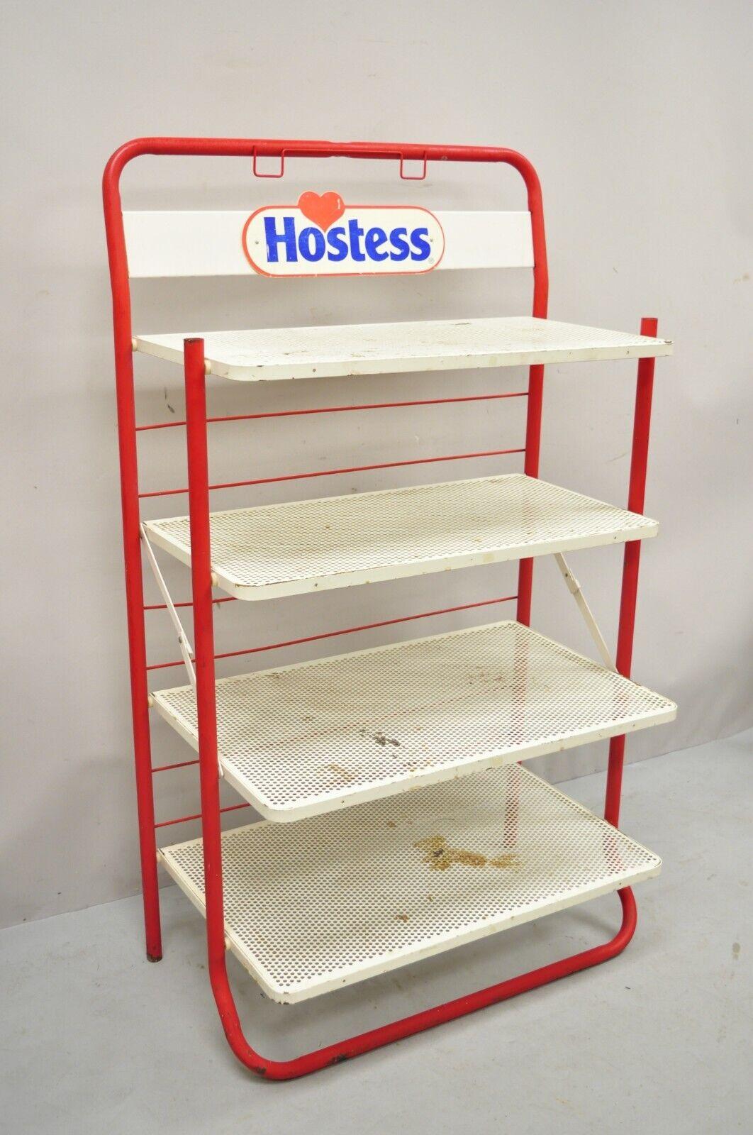 Vintage Hostess Red Metal Perforated 4 Shelf Folding Display Shelf Stand. Item features folding design, original 