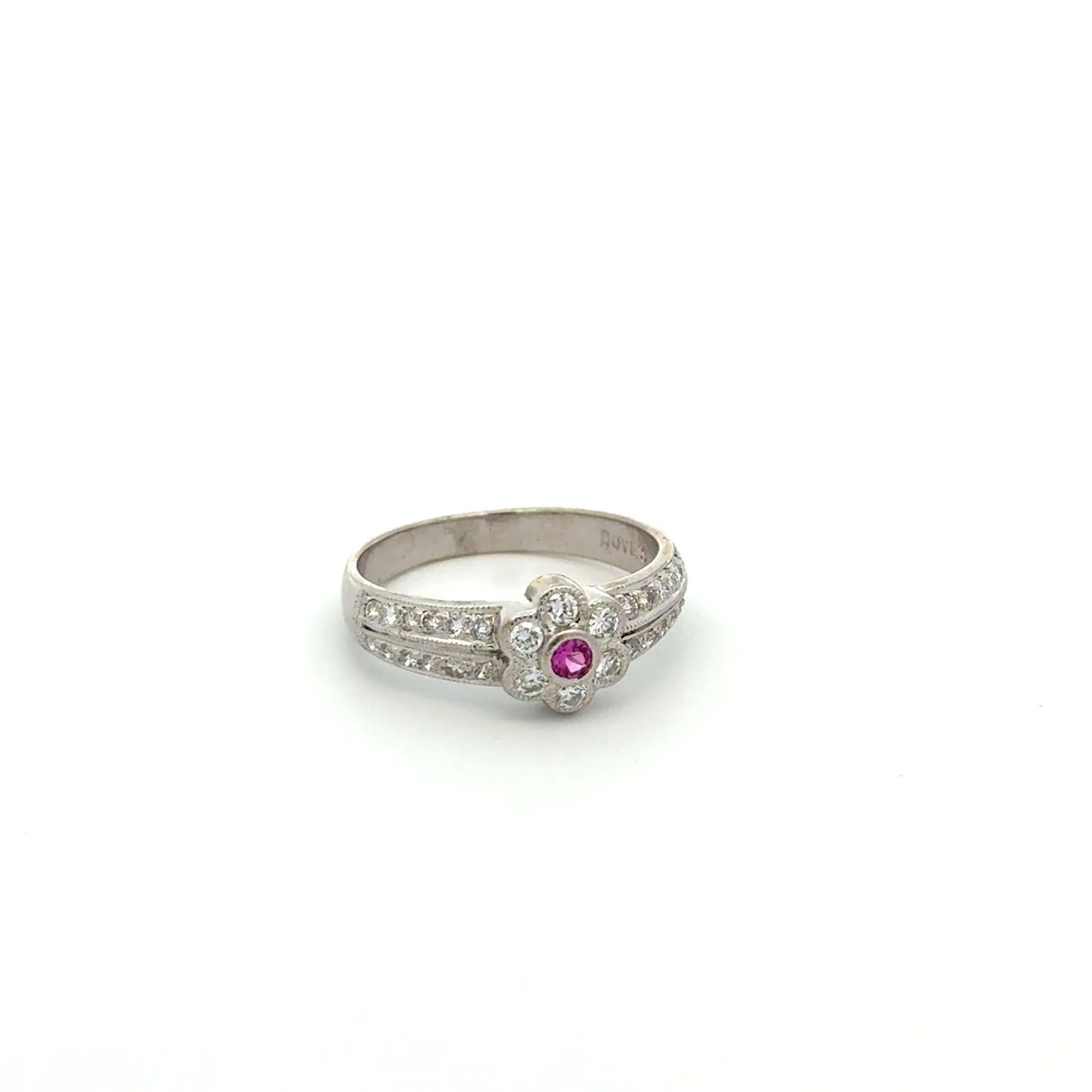 Simply Beautiful! Vintage Solitaire Hot Pink Sapphire and Diamond Gold Vintage Ring. Centering a securely nestled Hand set .08 Carat Hot Pink Sapphire. Surrounded and accented on shank by Diamonds, weighing approx. 0.30tcw. Hand crafted 18K White