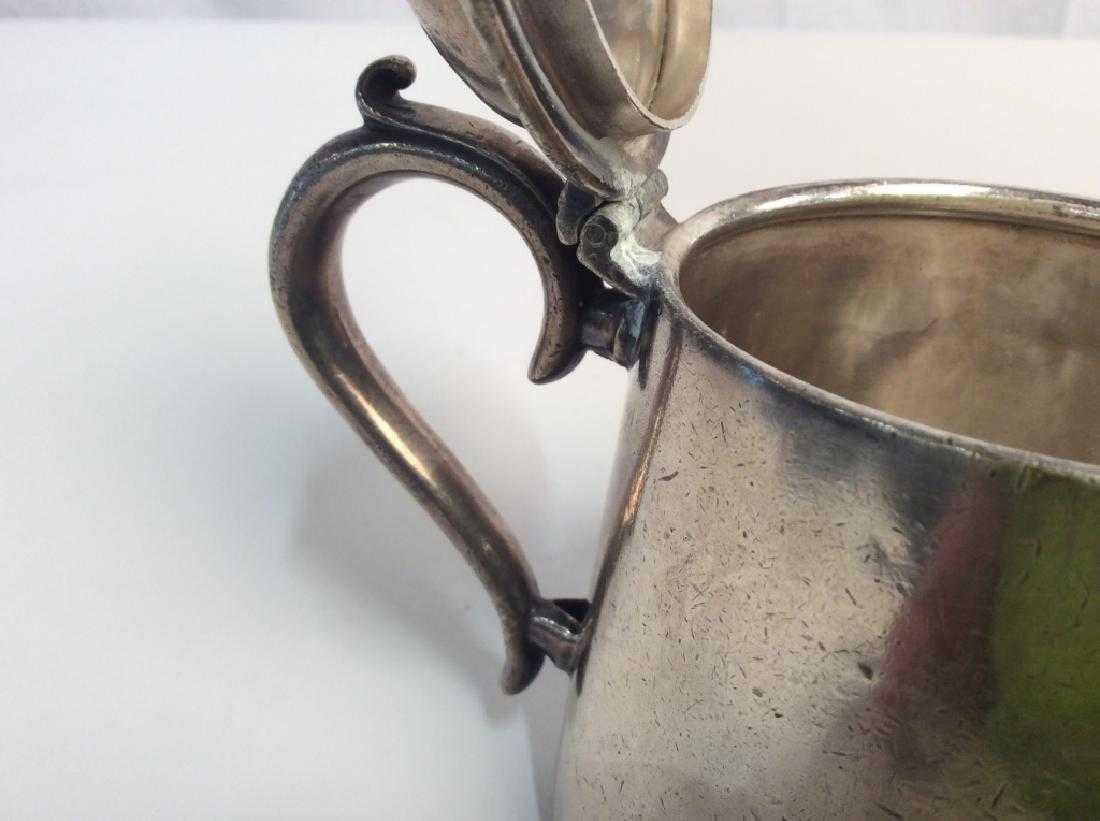 Vintage silver plated tea pot, 5 in x 7 in at widest point, some scratches and dents, marked Grace Line, an ocean liner, on one side of tea pot, underside marked 28088 e & co. In shield, Elkington Plate, 3/4 p, silver plate collectibles, tea service