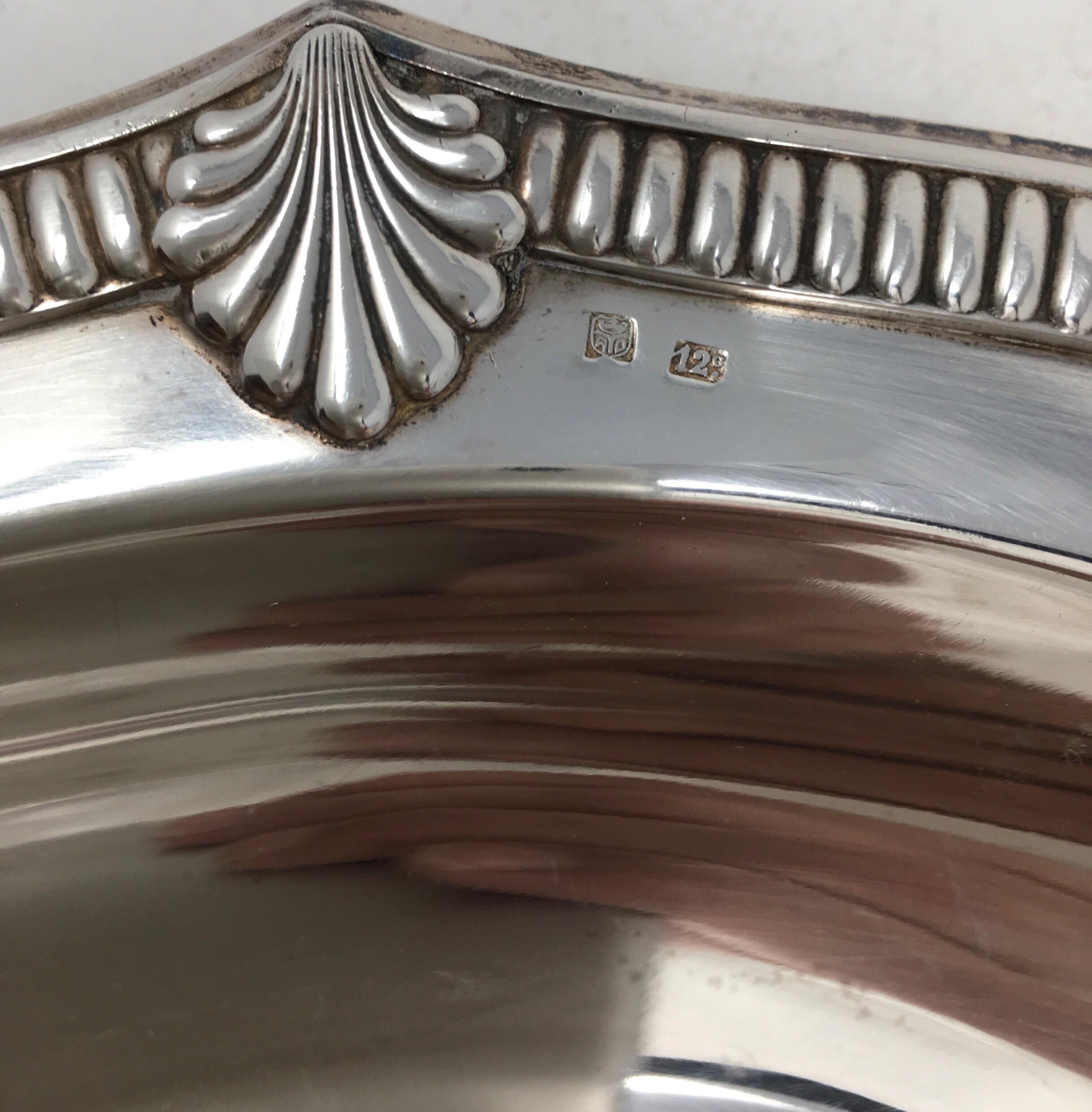 Found in France, this vintage hotel silver serving platter with beautifully detailed edge, has a great aged patina. It would be wonderful in a cabinet and a great addition to your table or buffet.