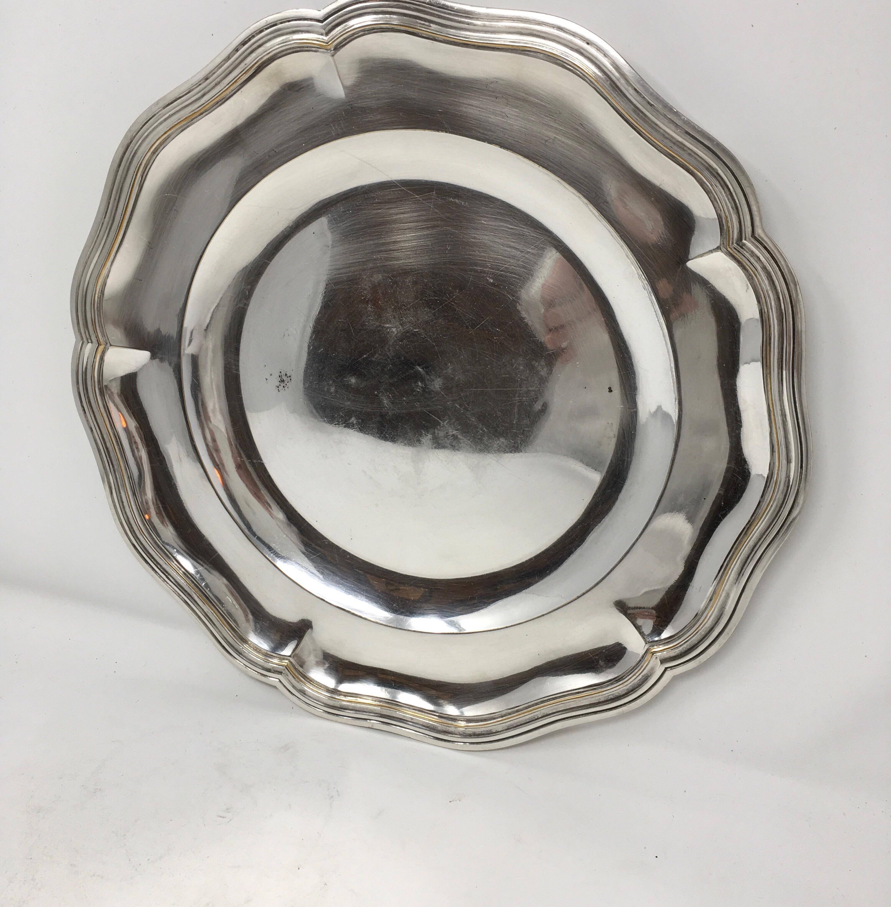 Found in France, this vintage hotel silver serving platter with beautifully detailed edge, has a great aged patina. It would be wonderful in a cabinet and a great addition to your table or buffet.