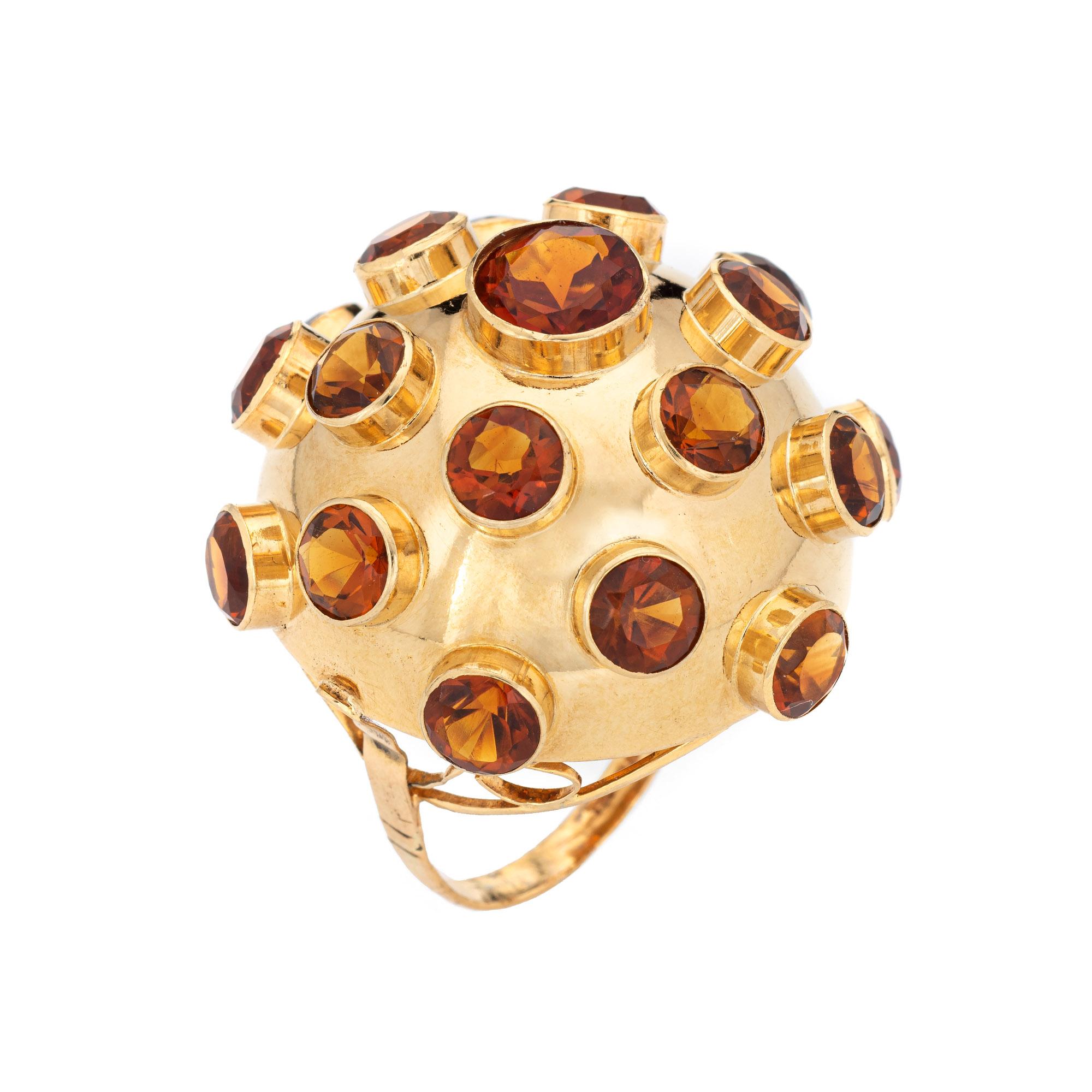 Ornate sputnik domed gemstone cocktail ring (circa 1950s to 1960s) crafted in 18 karat yellow gold. 

Citrines measure from 5mm to 8.5mm and total an estimated 12 carats. The gemstones are in very good condition and free of cracks or chips.

The