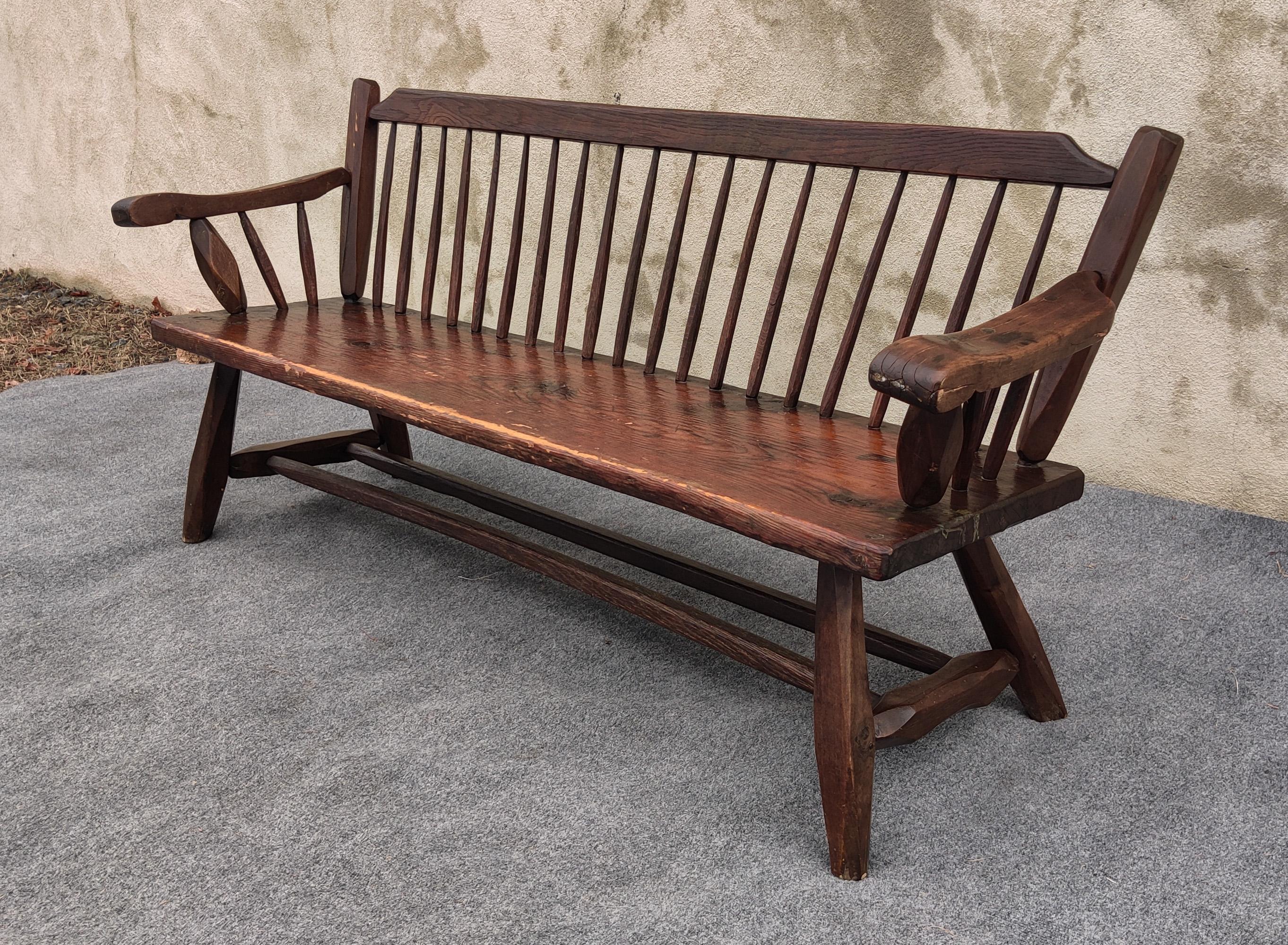 Made in the heart of the American Mid-West, this bench features classic American woods, and high-quality, almost homebuilt production. The large seat panel is a huge panel of cedar, hand-carved to show a nice grain texture. the spindles that adorn