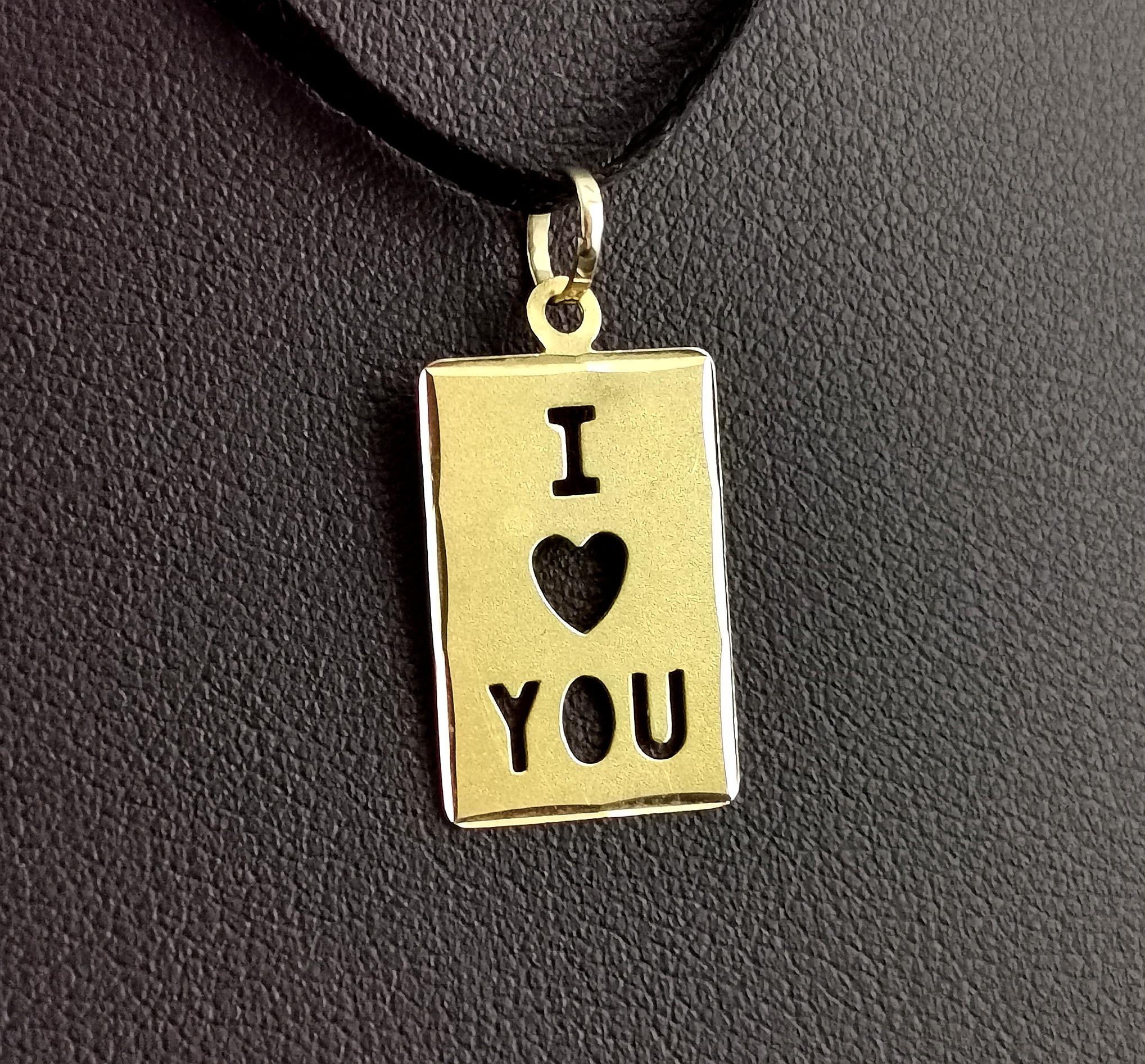 A sweet and dainty vintage 18ct gold I love you pendant or charm.

A slim card shaped rectangular pendant with cut out detailing with I a love heart and you.

What better way to say I love you in a piece of jewellery than literally I love you!

It