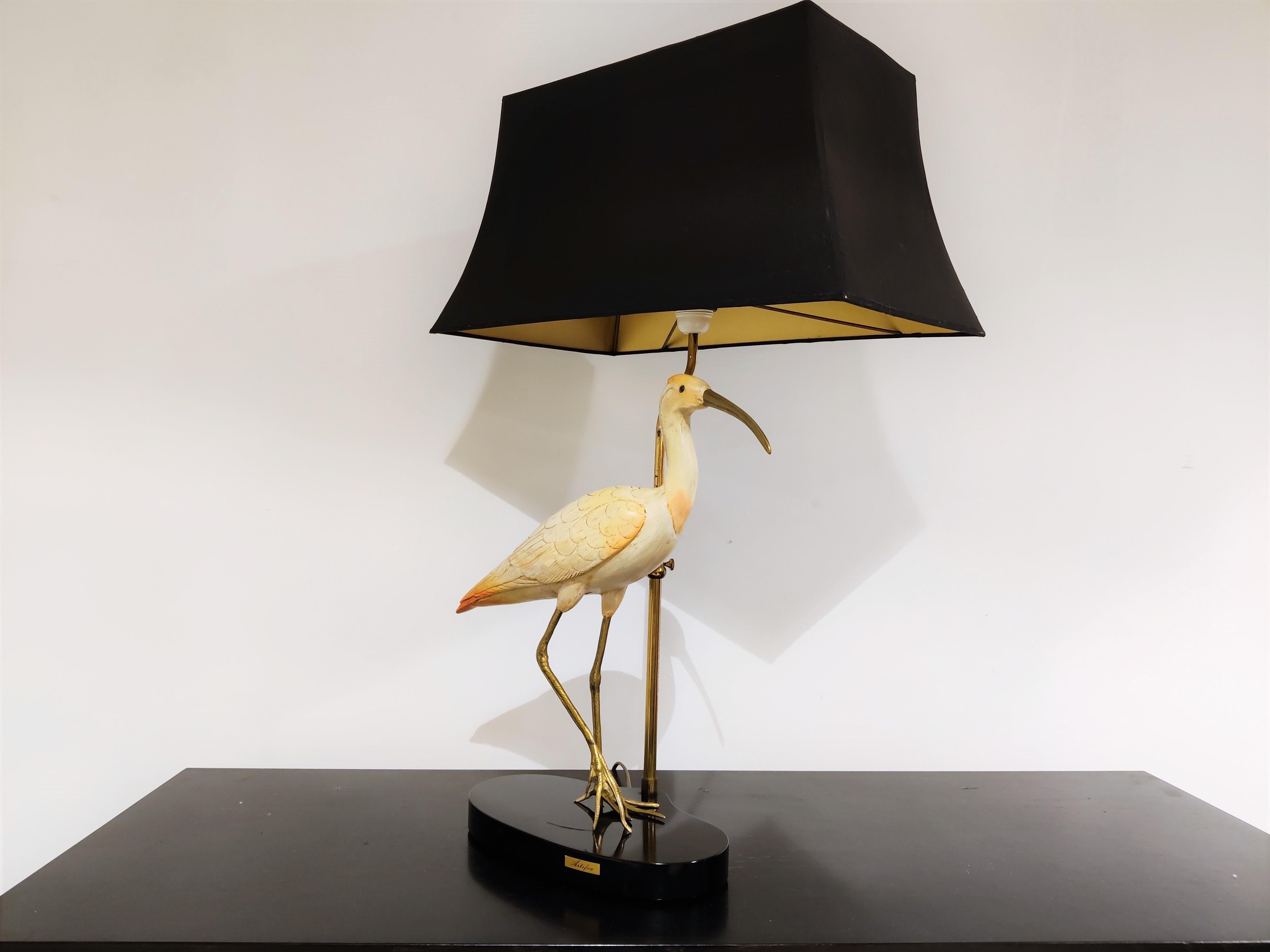 Higly detailed sculptural ibis or crane bird table lamp signed by Elli Malevolti for Artiflex.

Beautiful handmade resin sculpture with beautiful brass legs and head. 

1970s - Italy

Very good condition.

The lamp is tested and takes a